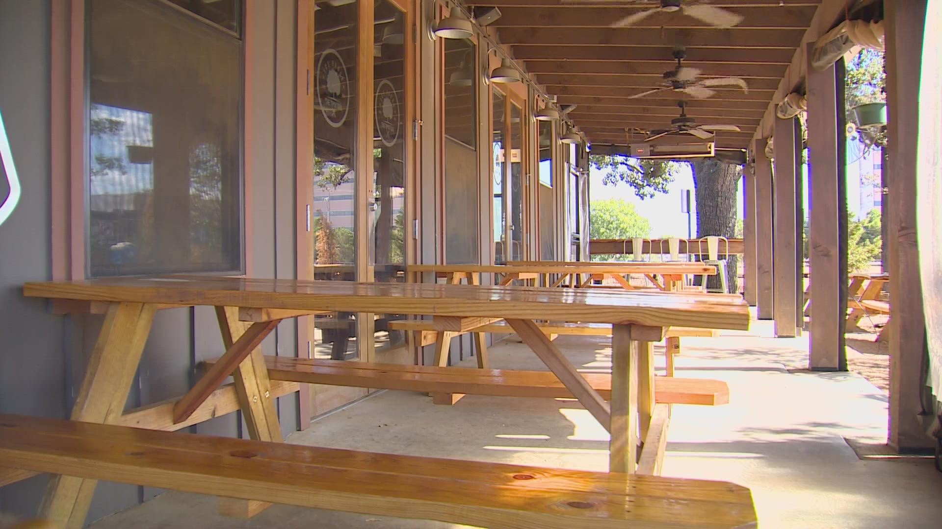 “It’s killing us right now,” said The Tipsy Oak manager Michelle Schexnayder. The Arlington restaurant's popular outdoor seating area was empty on Sunday afternoon.