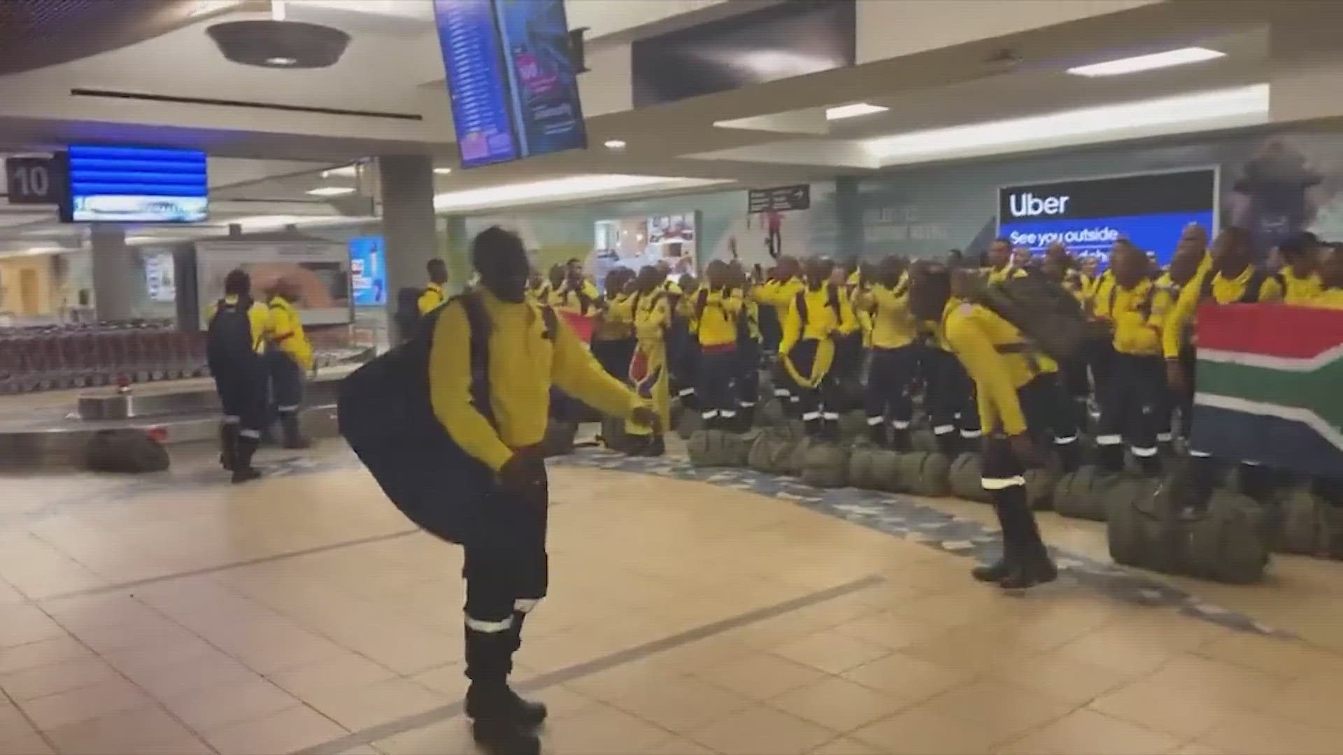 The firefighters performed a traditional song and dance upon their arrival at the Edmonton airport.