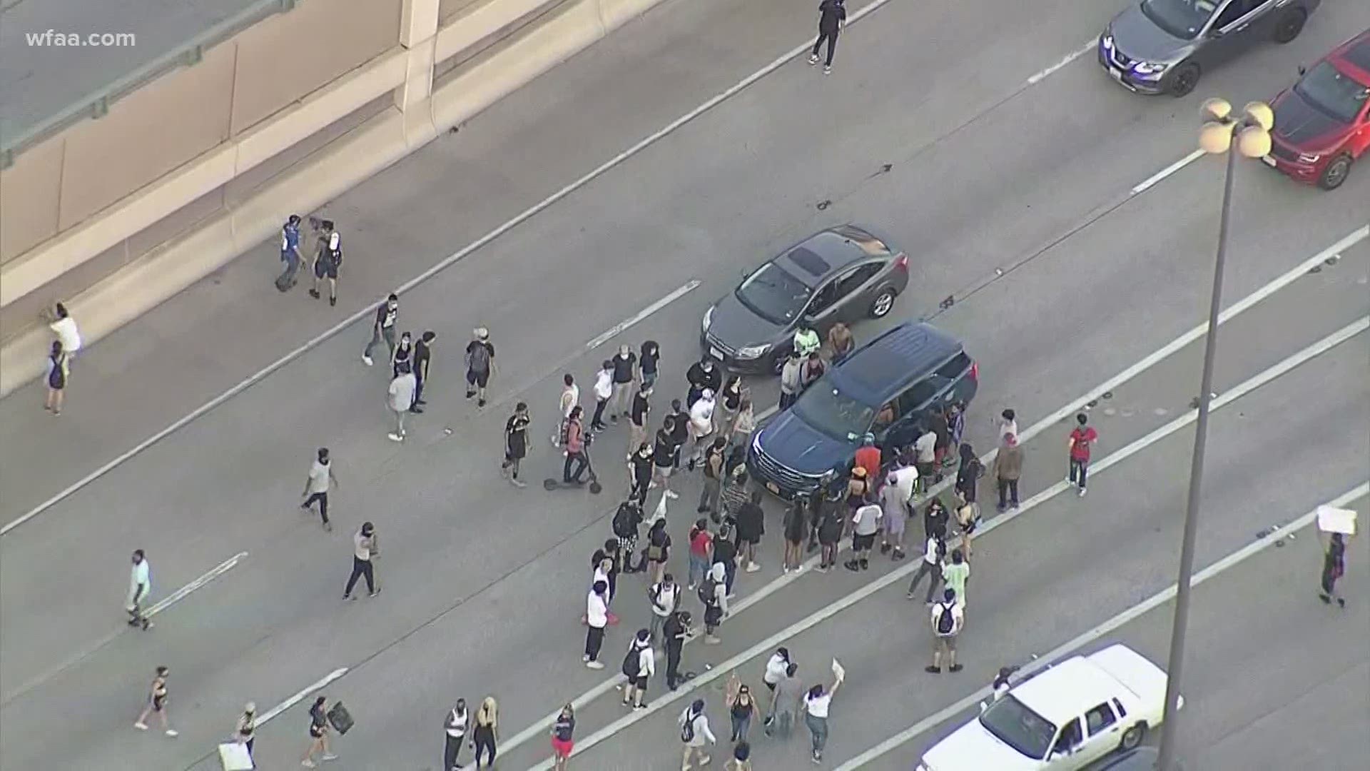 At least five protesters were arrested after blocking traffic on a Dallas highway