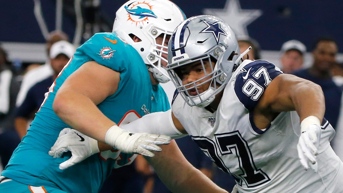 Dallas Cowboys defensive end Taco Charlton (97) walks off the