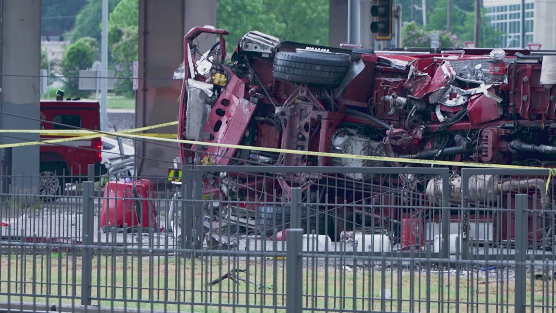 Downtown Dallas services are on hold after a Dallas firetruck fell more than 30 feet onto DART tracks.