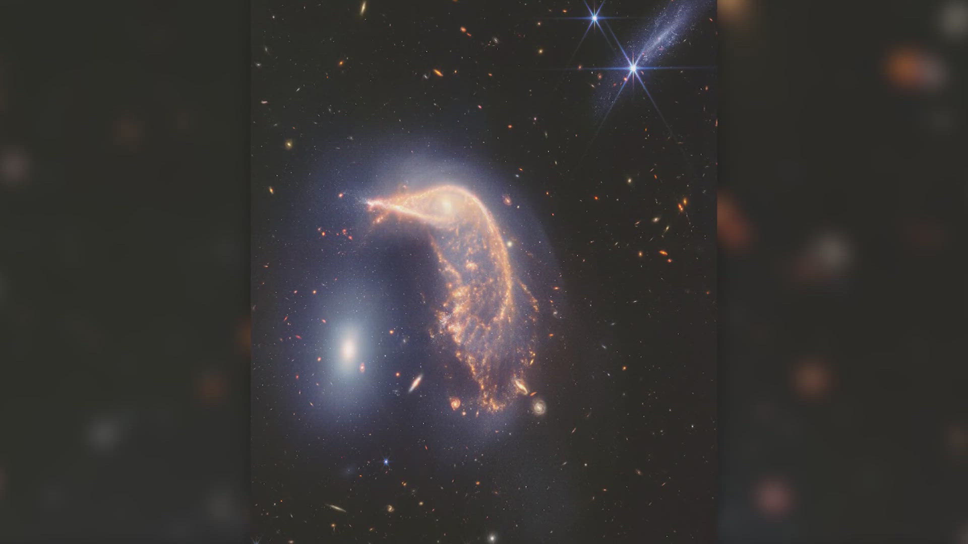 The photo shows a pair of intertwined galaxies NASA is calling "The Penguin and the Egg."