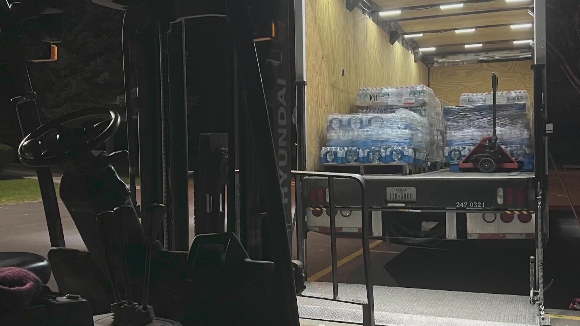 Fort Worth Officers Buddy Calzada and Jimmy Pollozani drove a box truck with pallets of bottled water across the country for people needing clean drinking water.