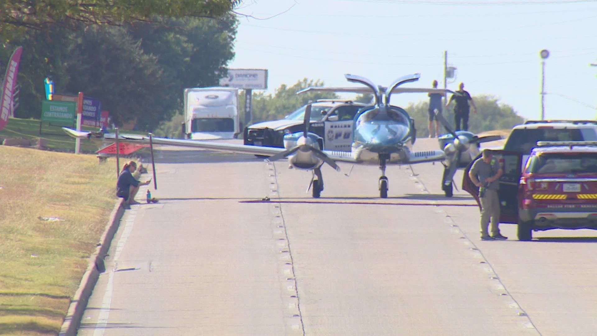 The plane departed from Snyder and reported engine problems before landing. Area streets were closed and power lines were downed, but officials report no injuries.