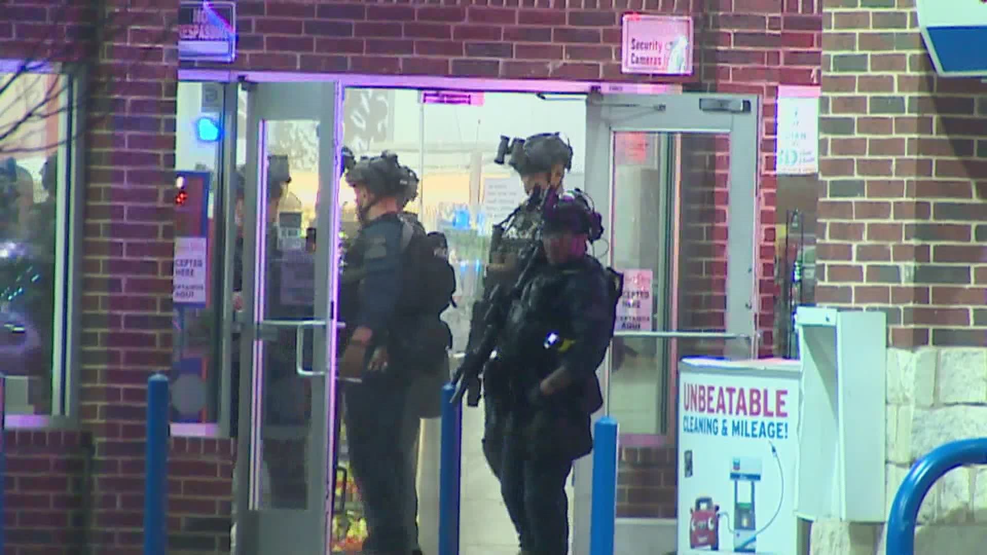 A tactical team responded the gas station and was able to rescue the clerk, police at the scene told WFAA.