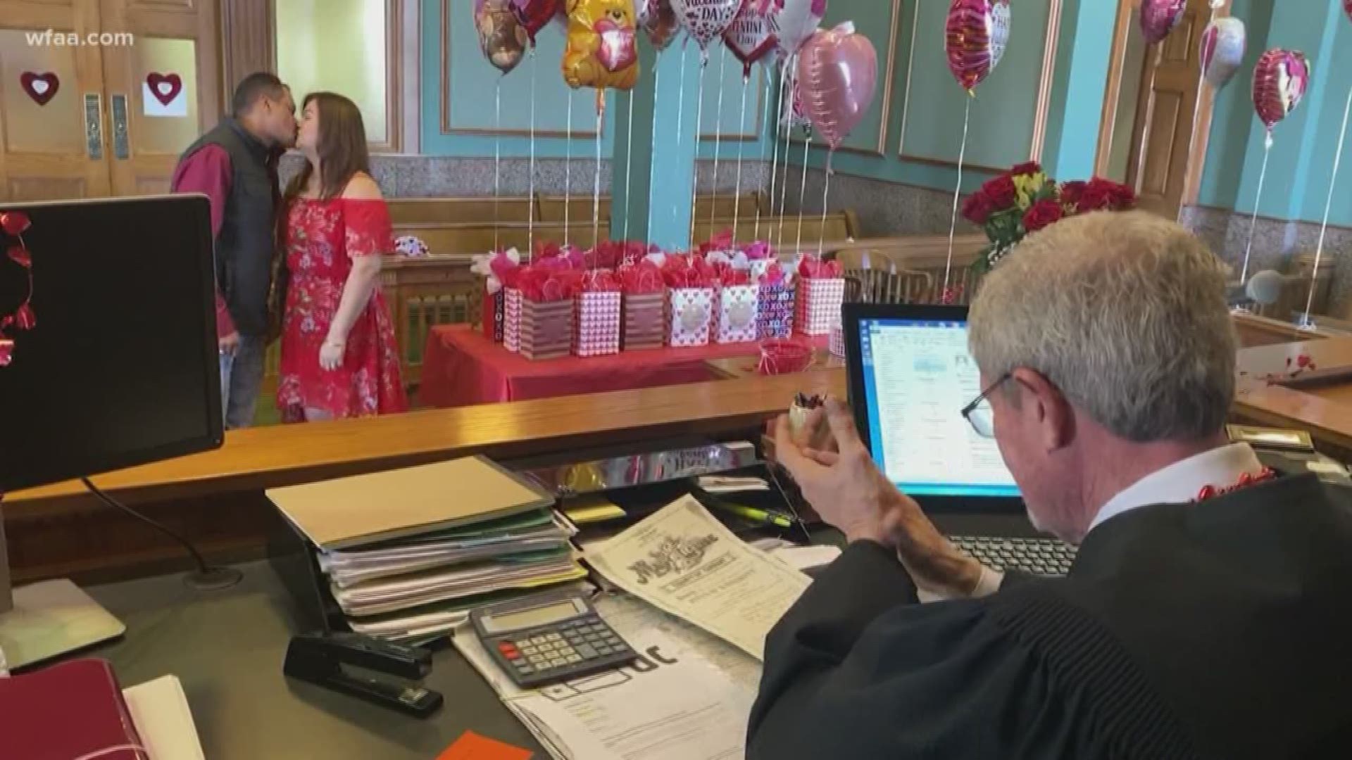 Ralph Swearingin, Jr., justice of the peace, gave out gifts and balloons to everyone who got married in his elaborately-decorated courtroom Friday.