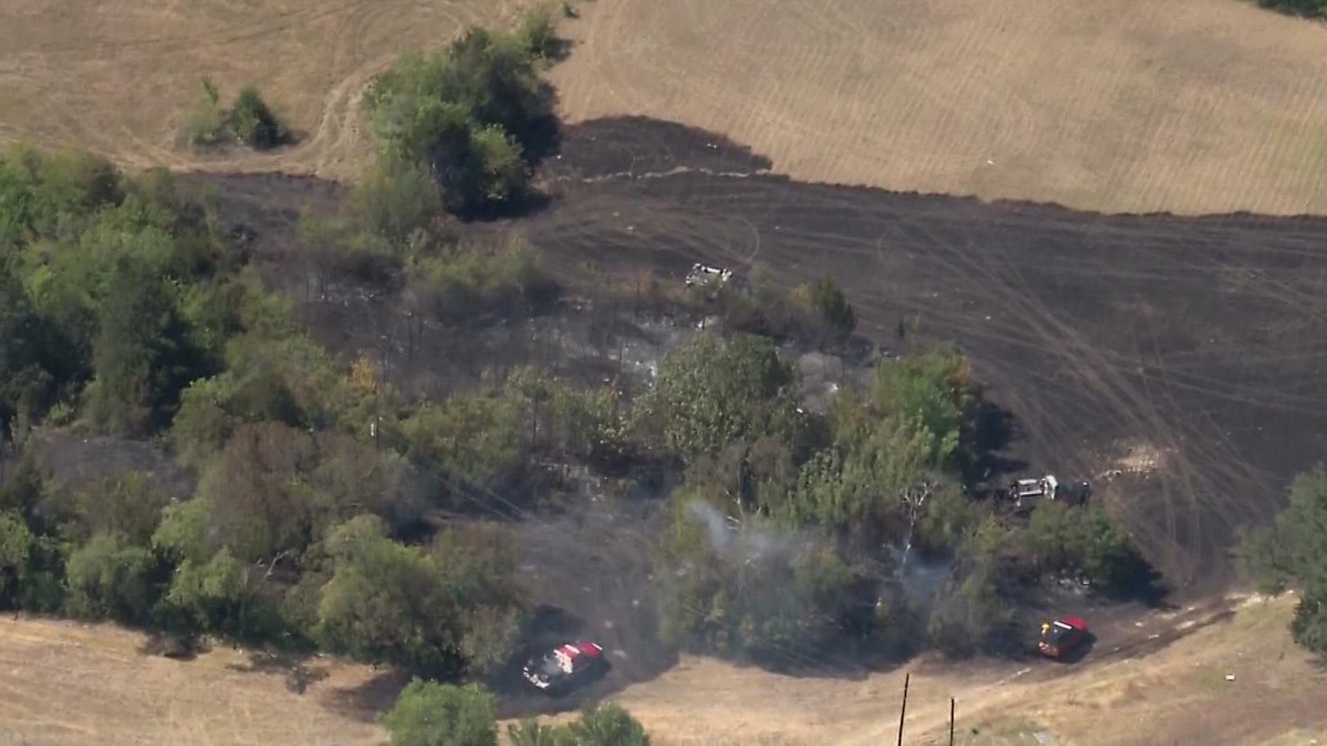 The fire started along U.S. Highway 67 and 9th Street and threatened homes in the Northridge neighborhood.