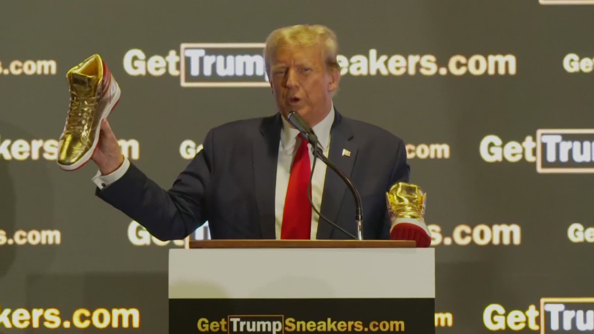 Trump was met with loud boos as well as cheers at the Philadelphia Convention Center as he introduced what he called the first official Trump footwear.