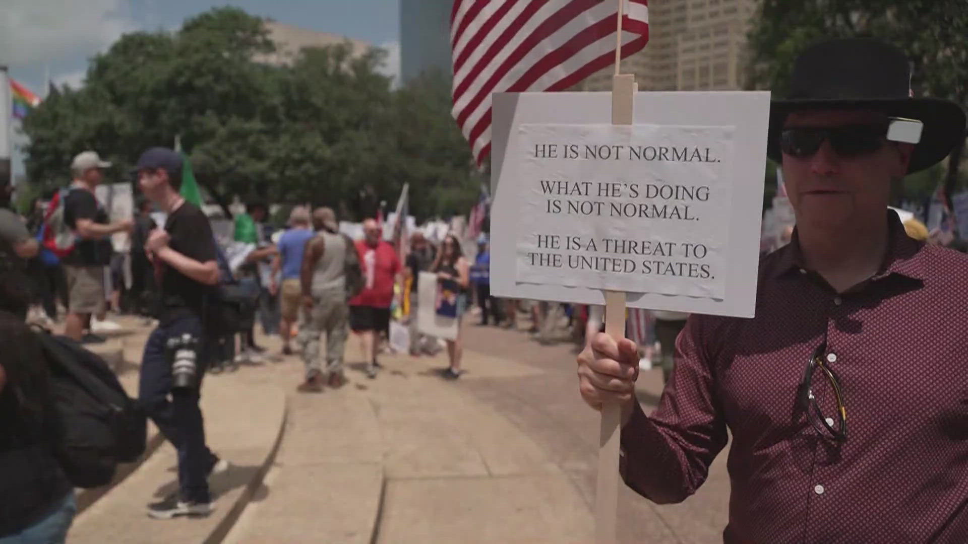 The protest featured several speakers talking about President Donald Trump's policies outside Dallas City Hall before marching through Downtown.
