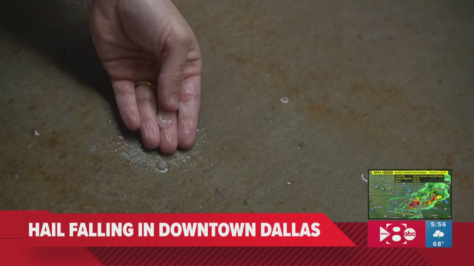 WFAA's William Joy provides a live report in downtown Dallas on Thursday as hail is starting to come down in the area.