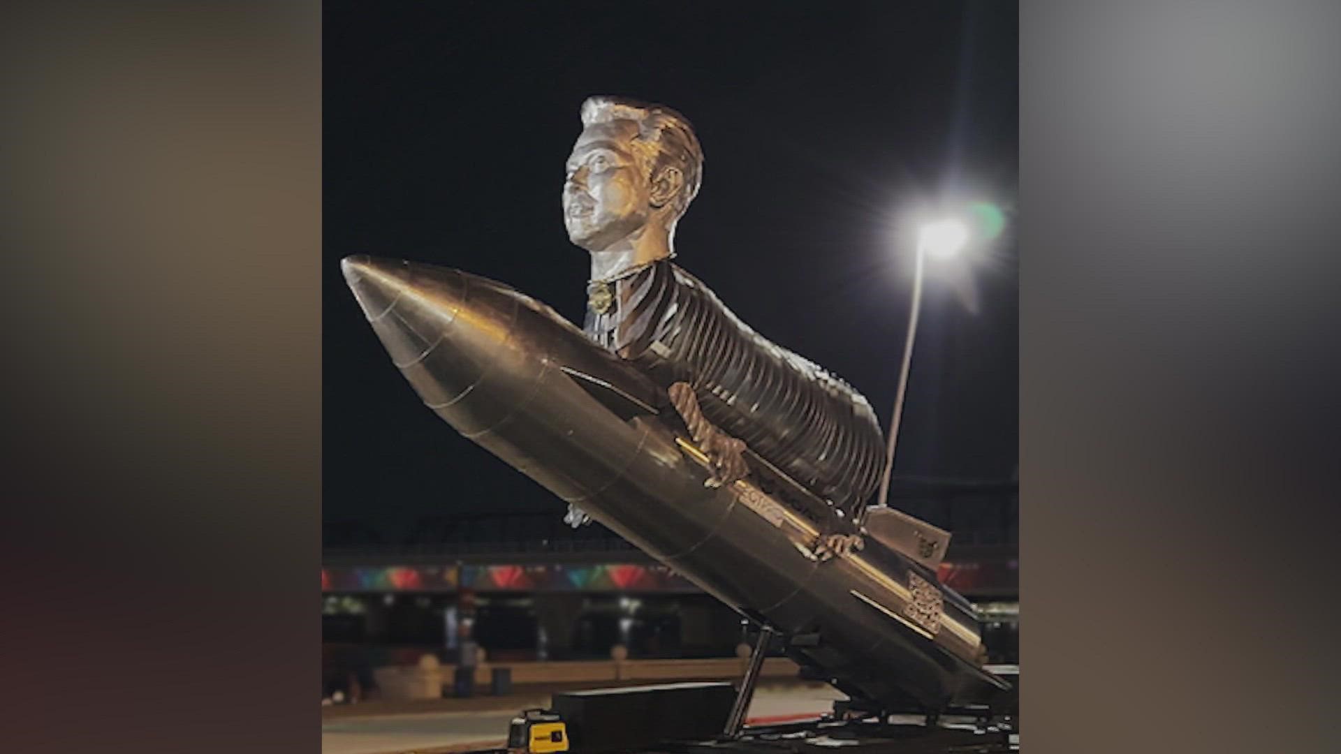 The sculpture depicts Musk's head on the body of a goat, all on top of a rocket. It's supposed to symbolize that Musk is the GOAT (greatest of all time).