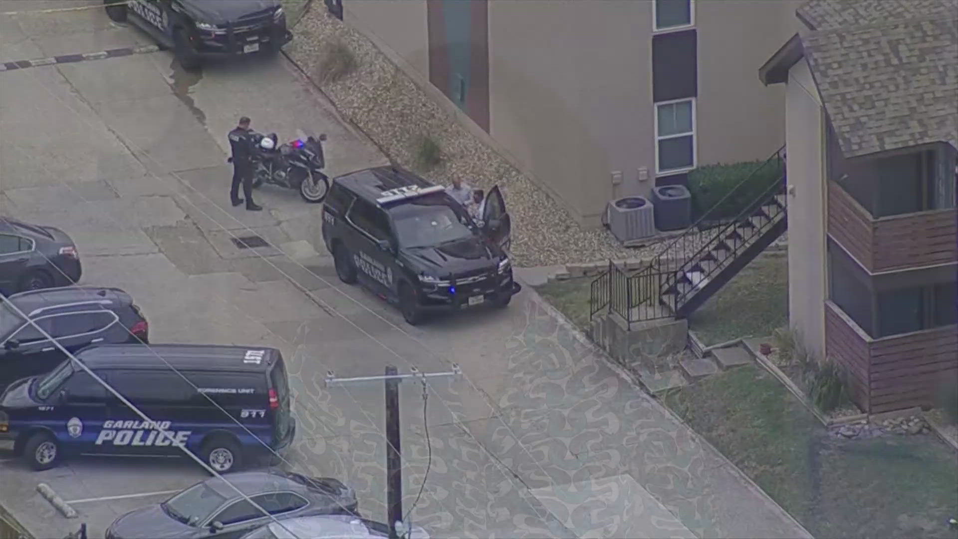 Two people were shot in an apartment Tuesday morning, Garland police say. A suspect is in custody.