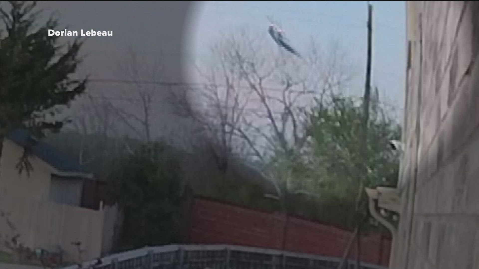Police say the pilot died after crashing into a wooden area near a neighborhood.