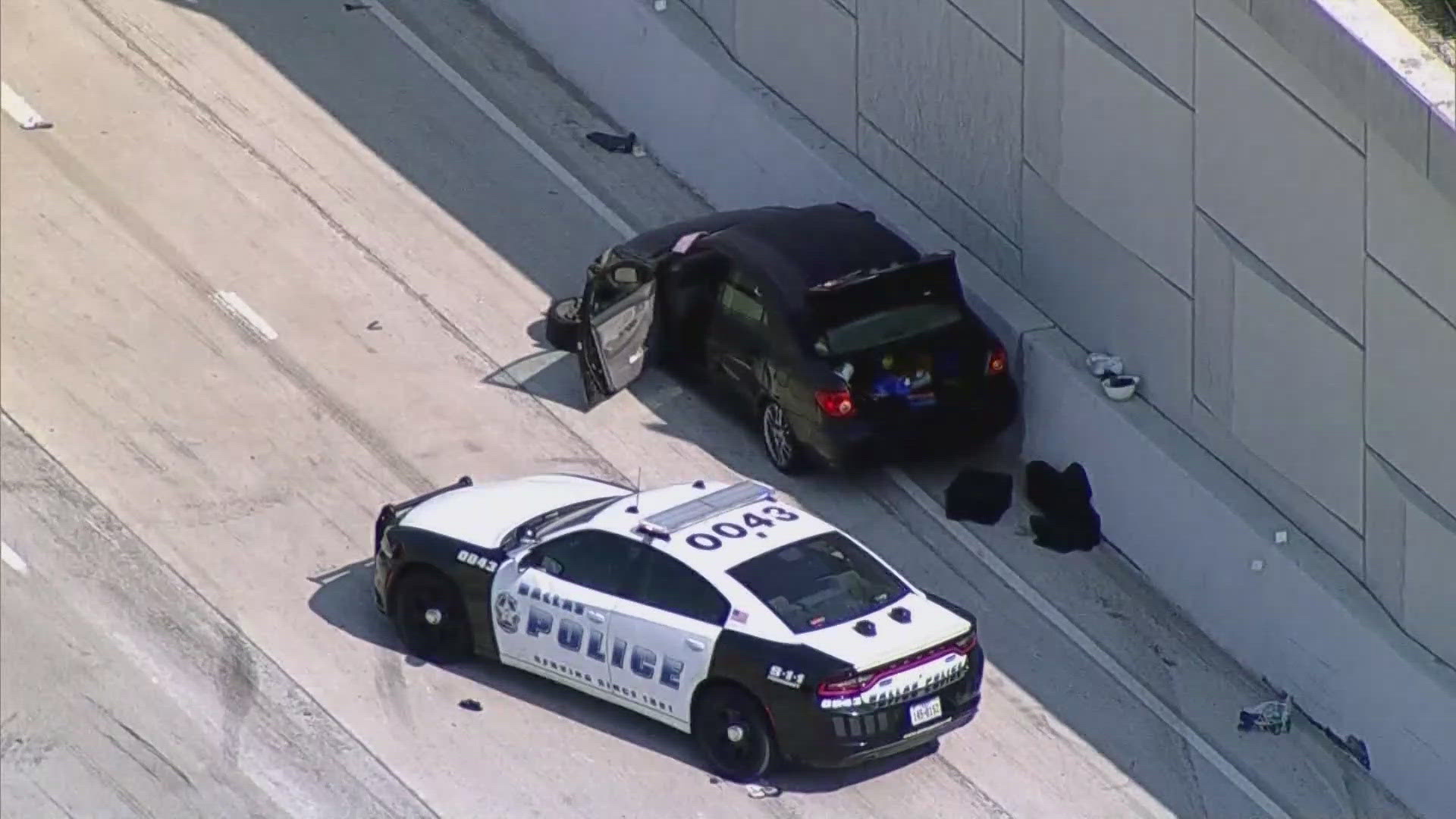 ​All of the main lanes of the highway, and the two shoulder lanes, were blocked at Forest Lane, according to the Texas Department of Transportation.