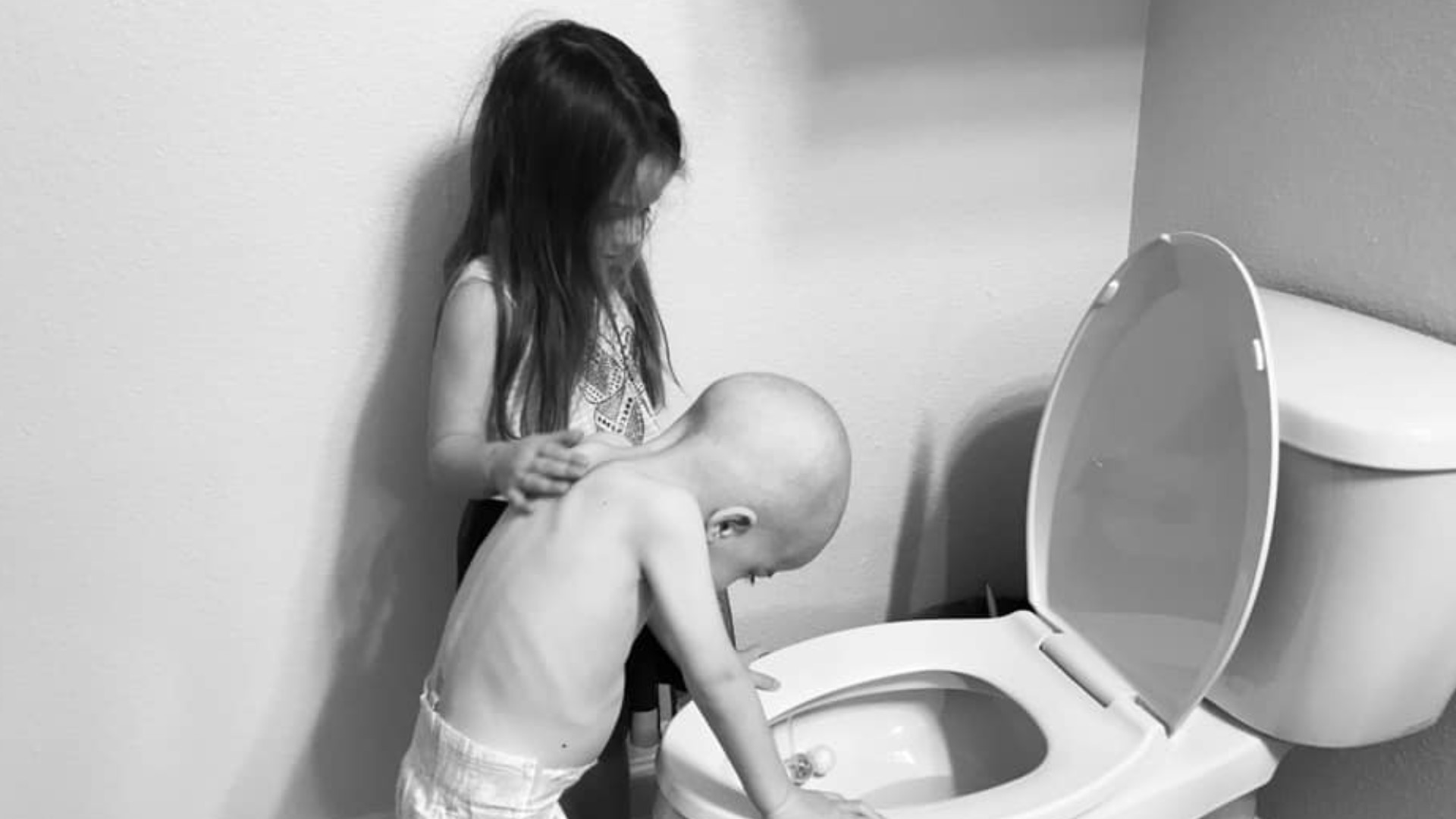 The pictures are not pleasant and they are not supposed to be. The first shows a 4-year-old boy, bald from his first round of chemotherapy, standing over a toilet and reeling from the nausea his treatments bring. His 5-year-old sister stands at his side, her hand on his shoulder, trying to comfort him when no one else can.