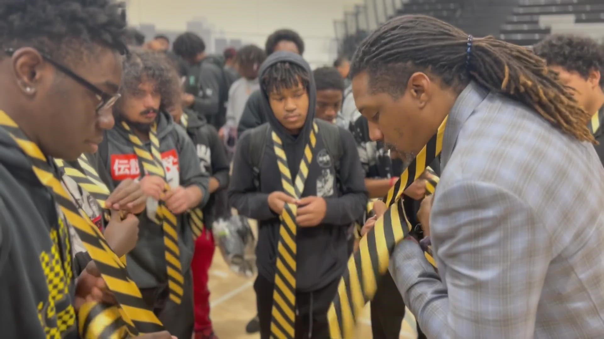 Dozens of students at South Oak Cliff High School learned from mentors on how to put on a tie.