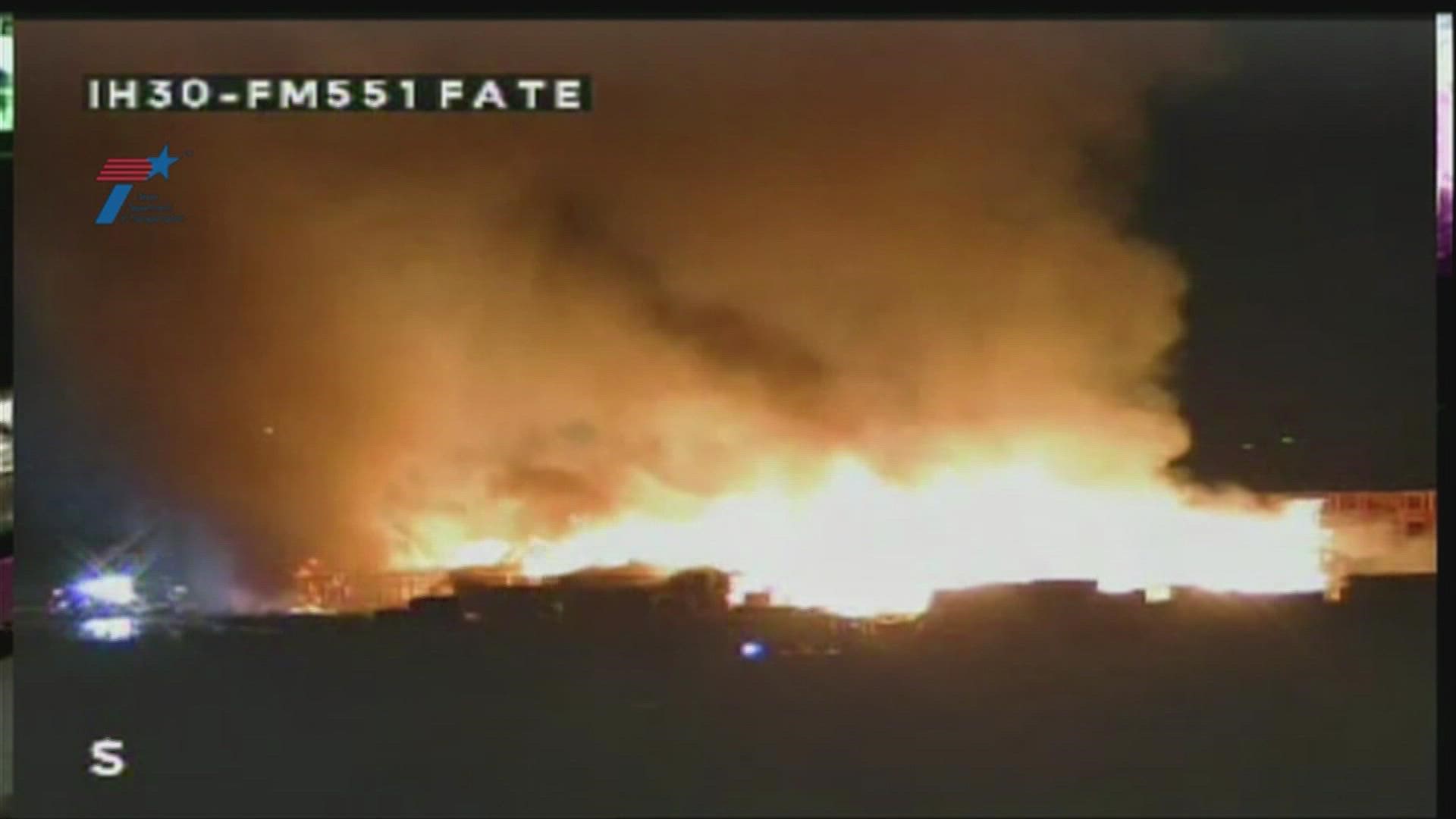 Texas Department of Transportation cameras at I-30 and Farm Road 551 in Fate showed a large, active fire that was burning what appeared to be a structure.