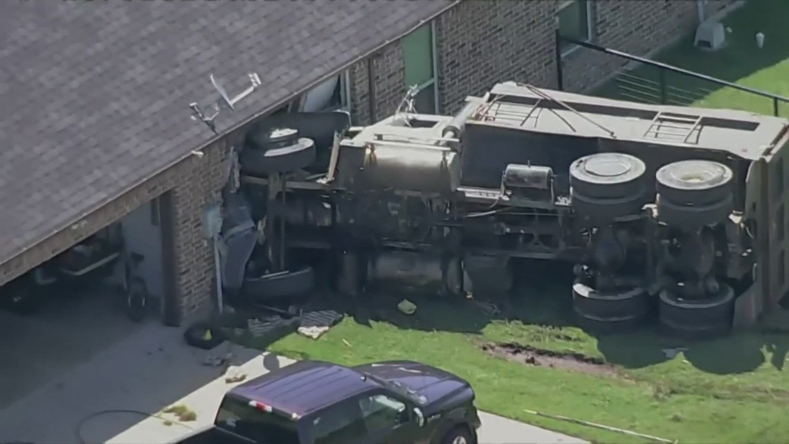 Dump truck driver was injured after crashing into a house in North ...