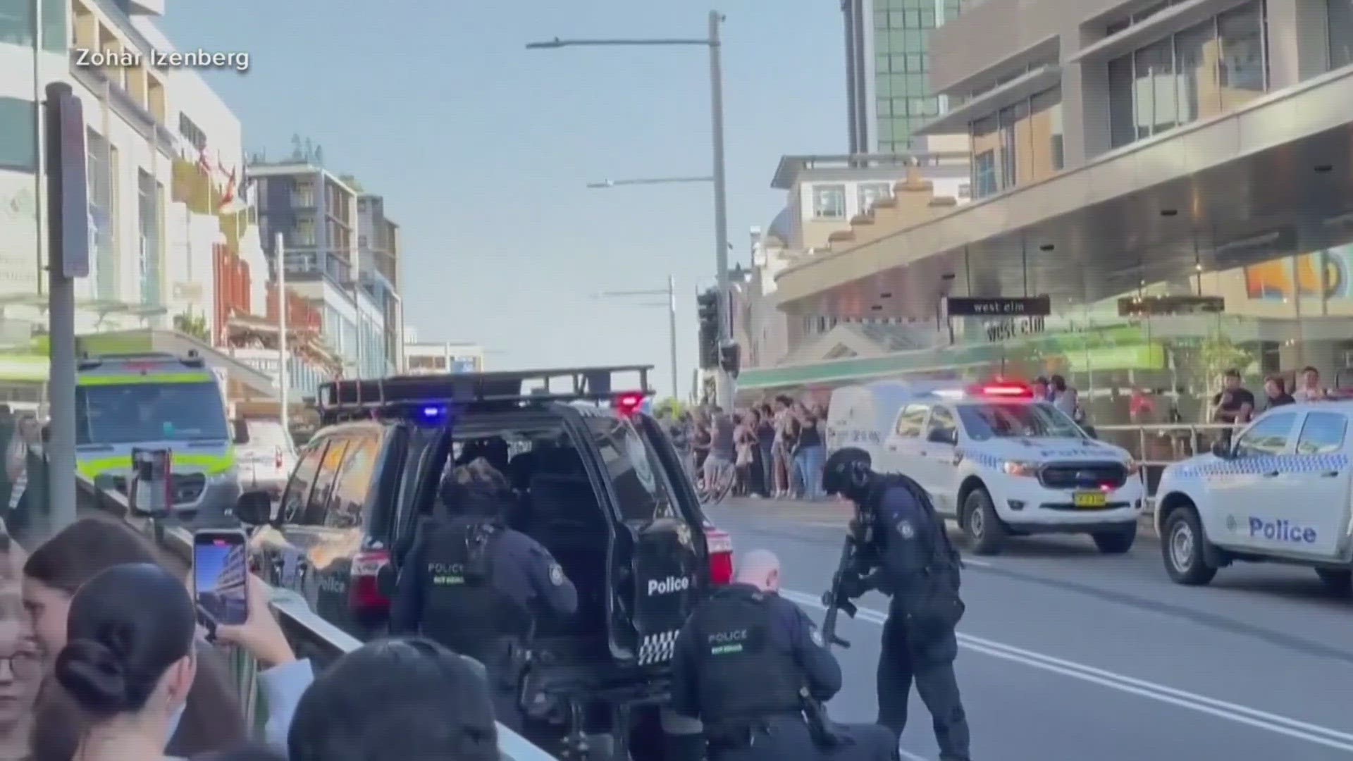 A man stabbed six people to death at a busy Sydney shopping center Saturday before he was fatally shot, police said.