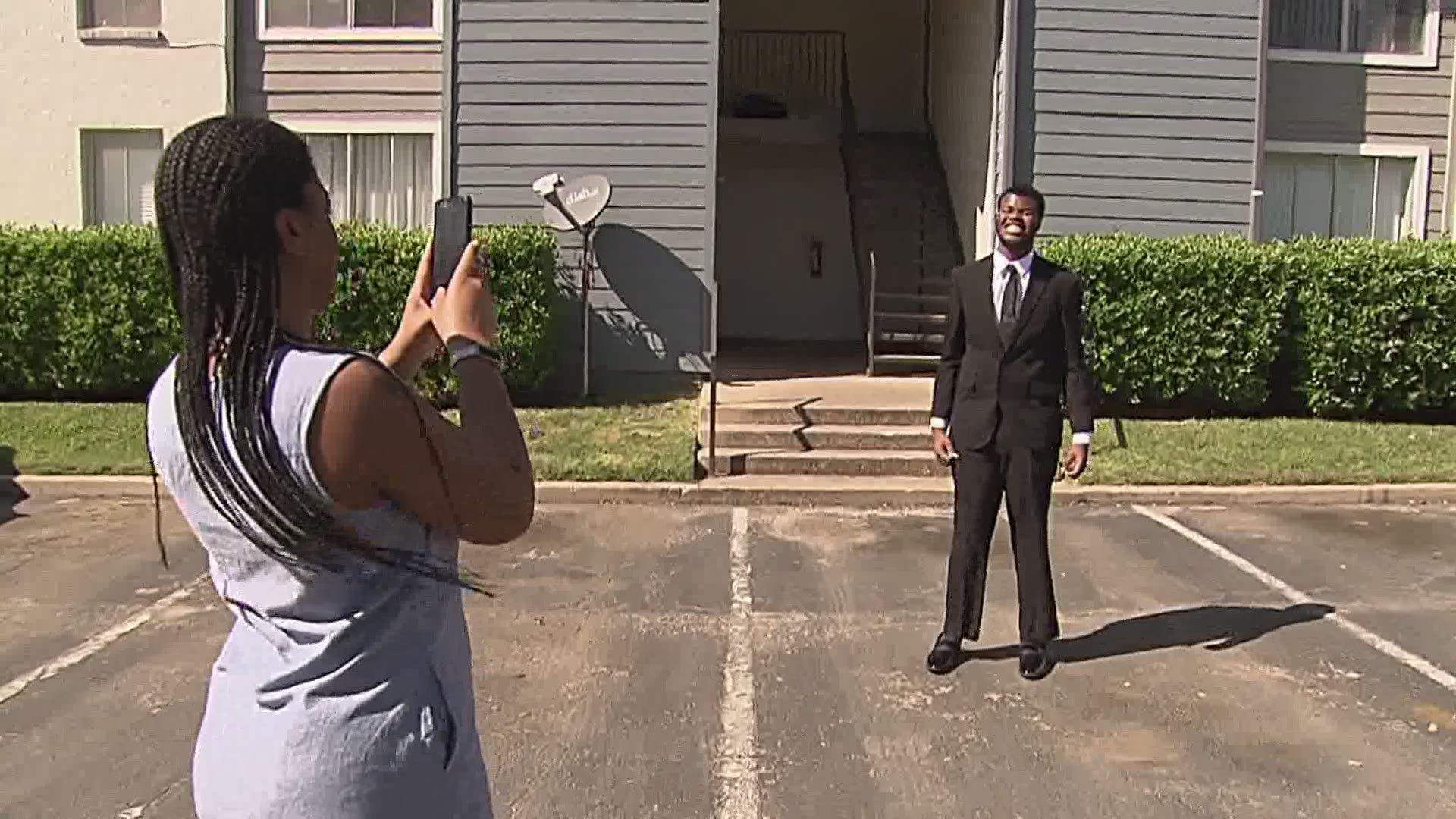 The students put on their new outfits, turned on music, and posed for photos in front of their homes.