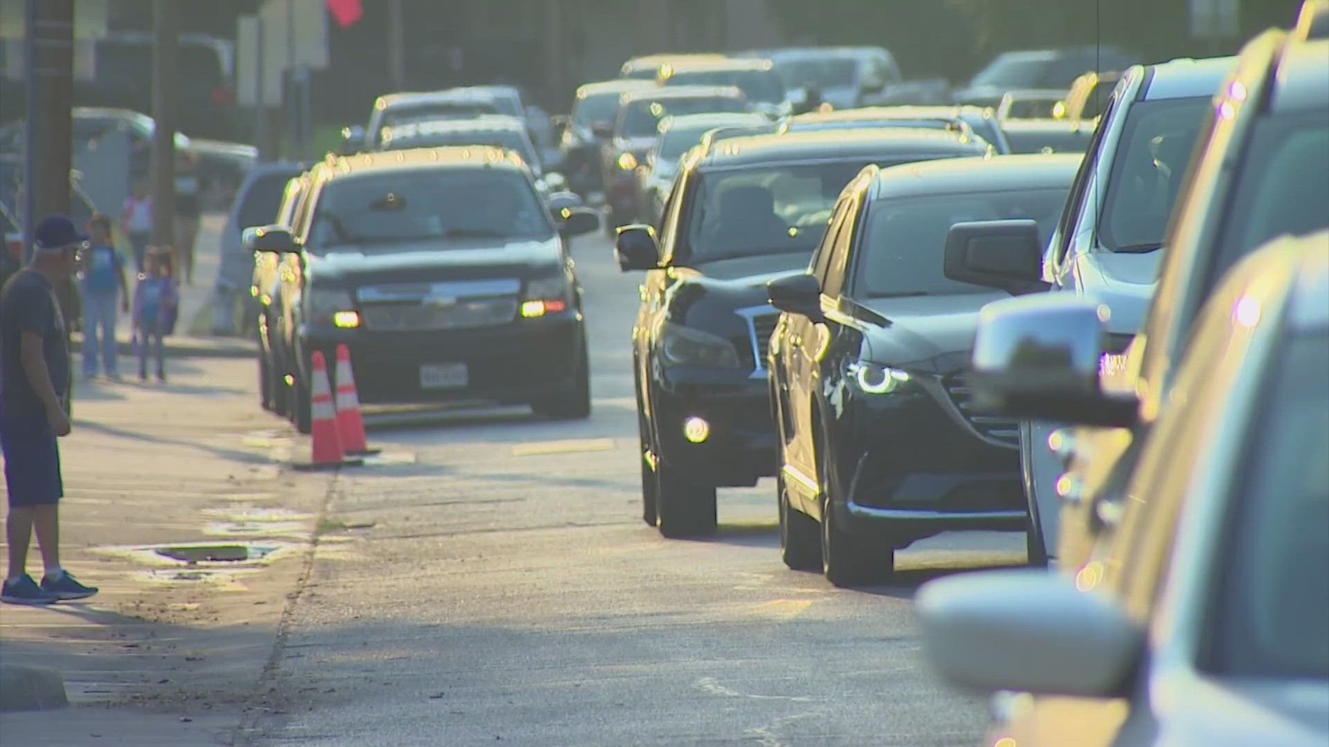 Parents and guardians in the pick-up line shared mixed feelings over the increase in traffic and change in traffic flow.