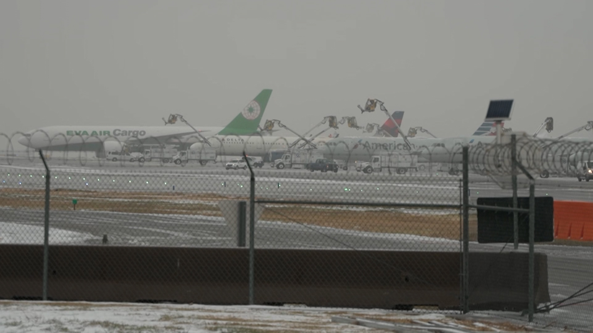 DFW Airport was having to de-ice numerous planes during the winter storm Thursday.