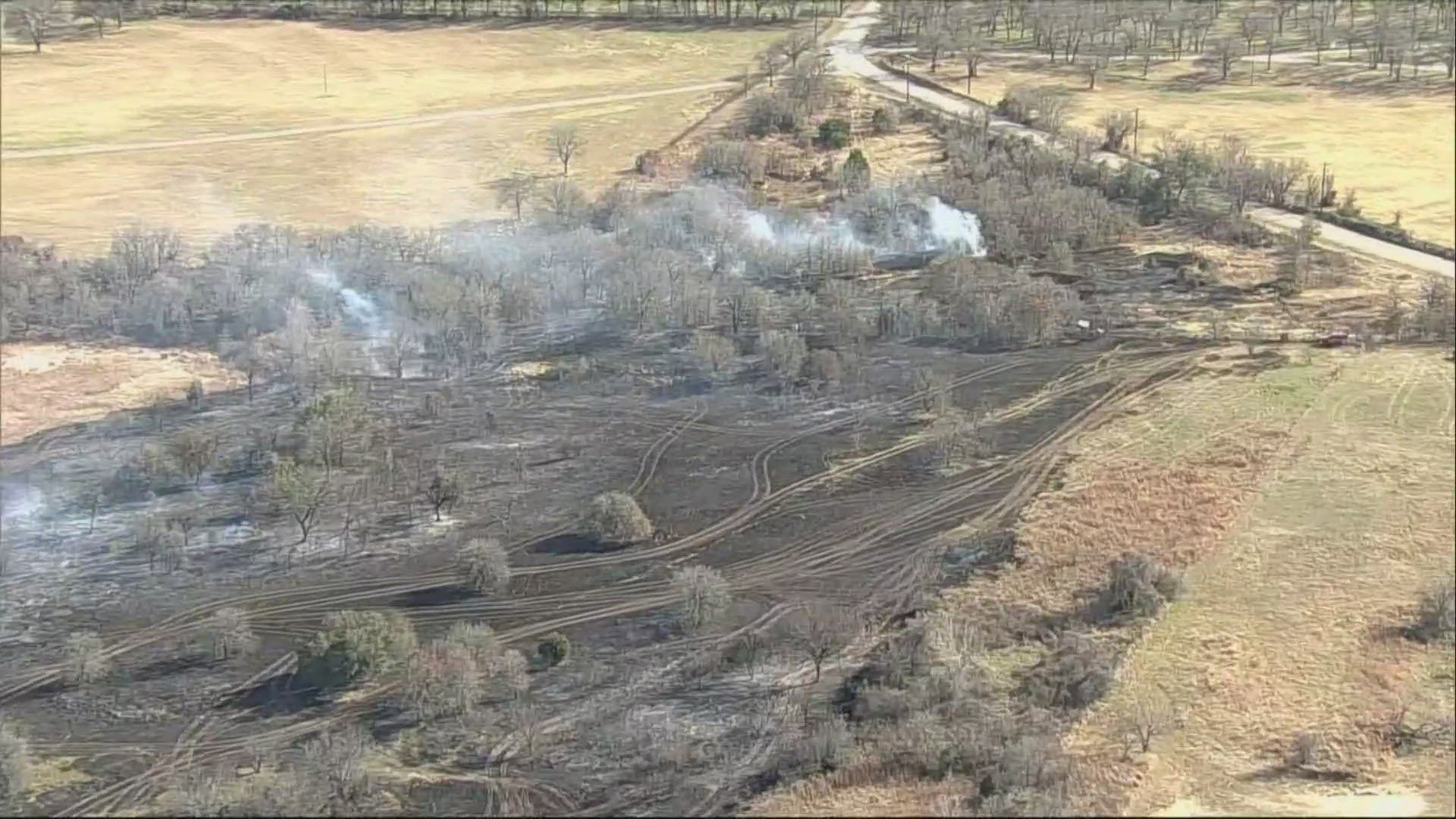 Firefighters battle wildfires in North Texas as strong winds fuel ...