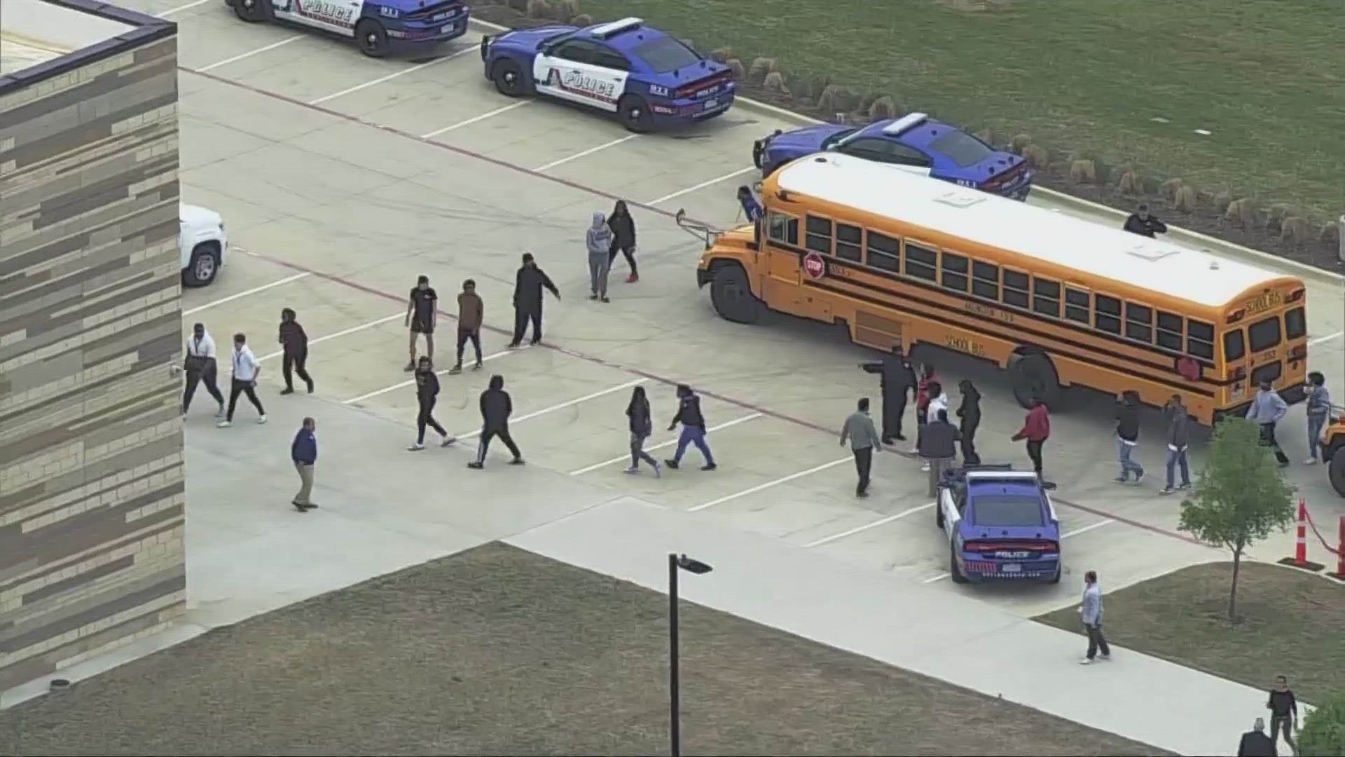 District officials say two students were injured at an Arlington high school on Monday morning. Police said a suspect is in custody.