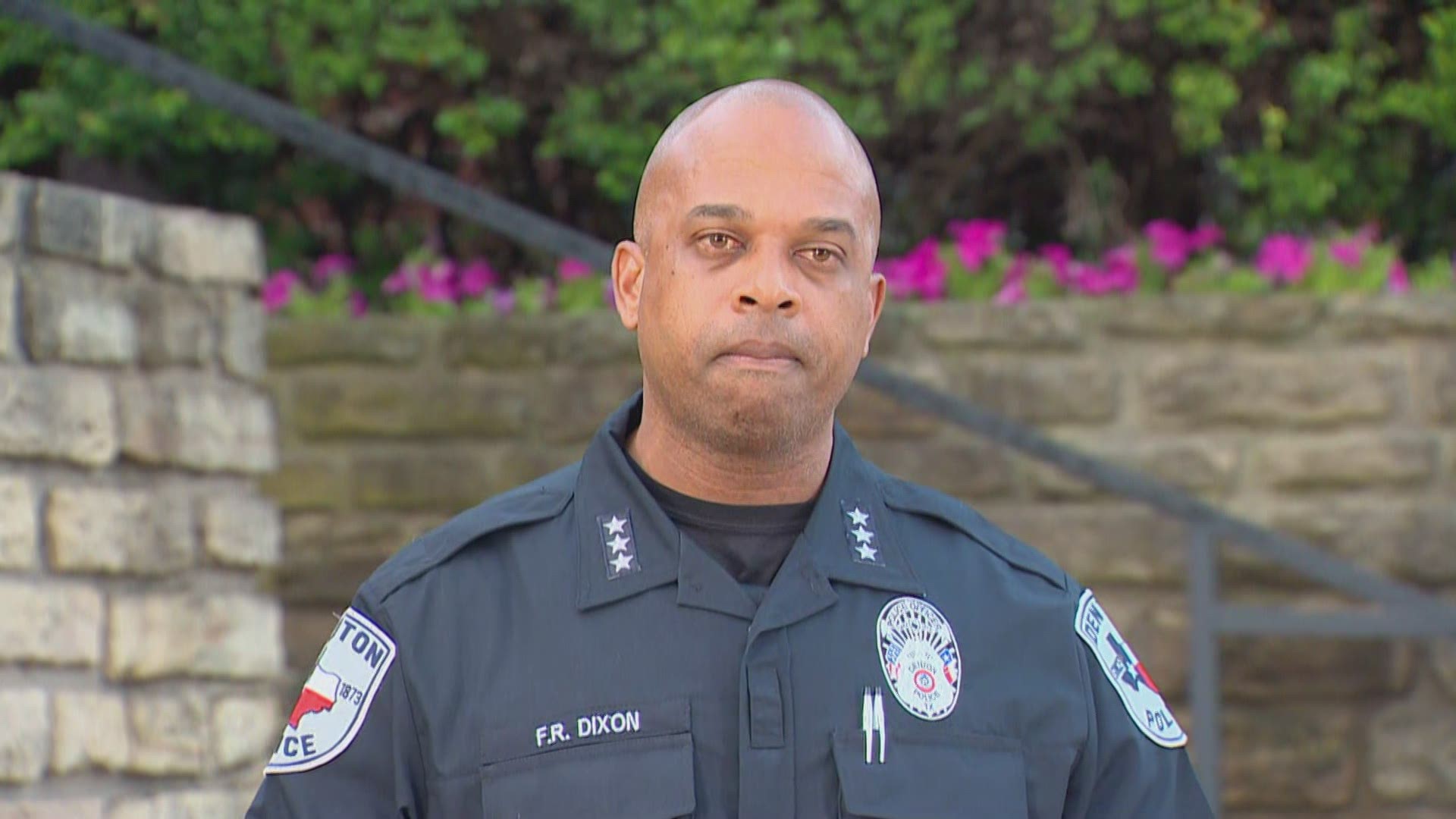 The man had fired at officers while holding a woman to him, Chief Frank Dixon said. He was shot twice by officers.