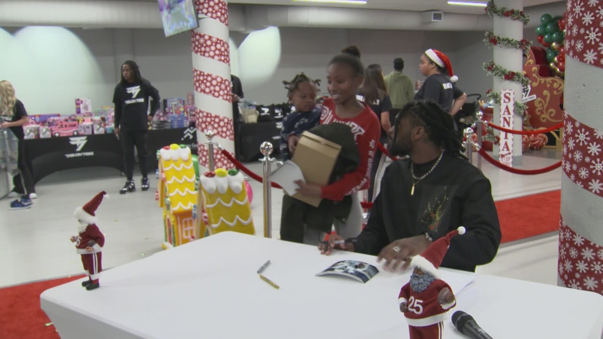 More than 50 children left Thursday's event with Christmas gifts, fresh haircuts, and the all-pro's autograph.