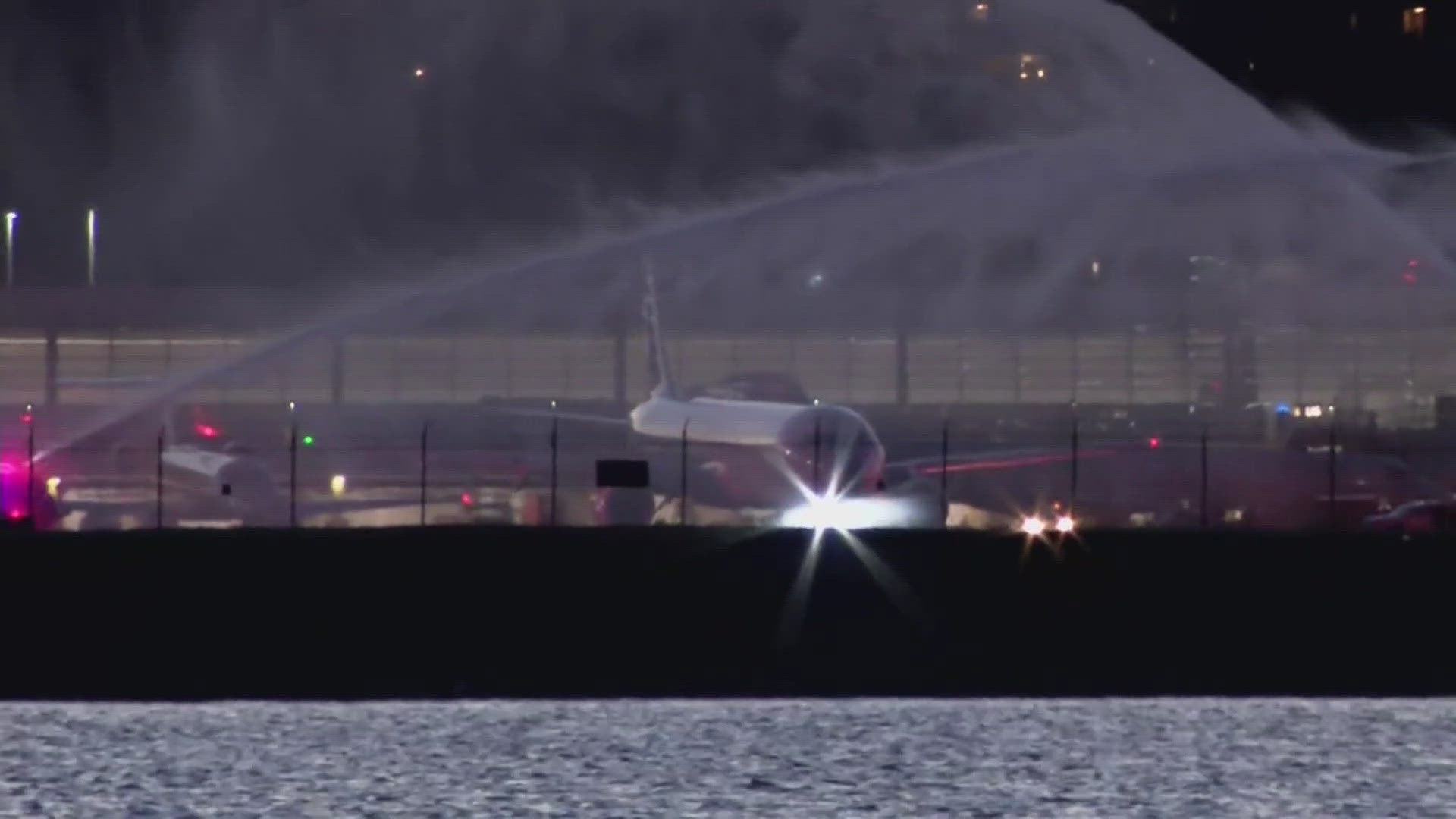 A water cannon salute took place at Reagan National Airport on Friday night to honor the American Airlines pilot who died in the crash.