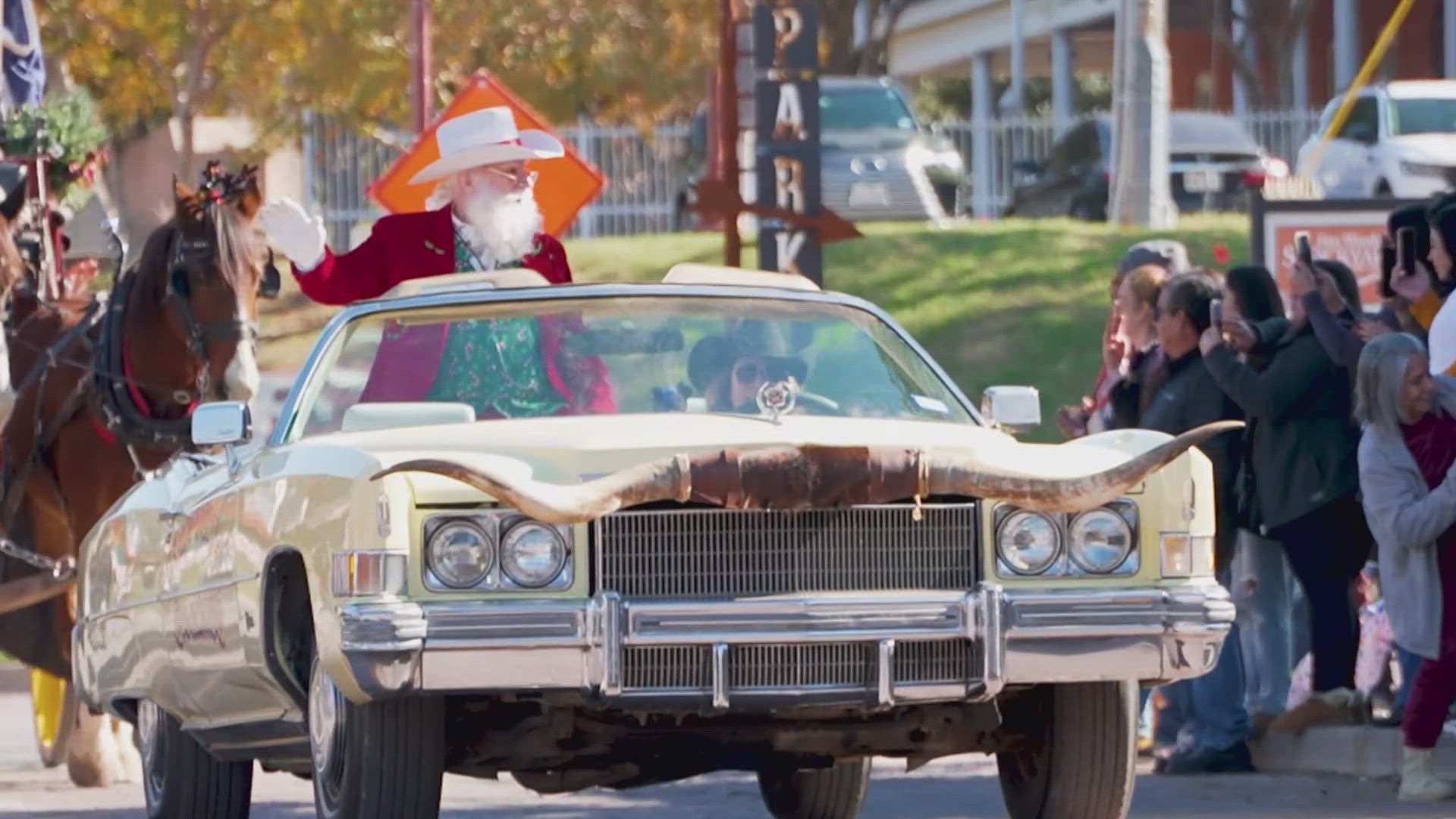 Cowboy Santa rode through the stockyards on a horse-drawn carriage and asked children what they wanted for Christmas.