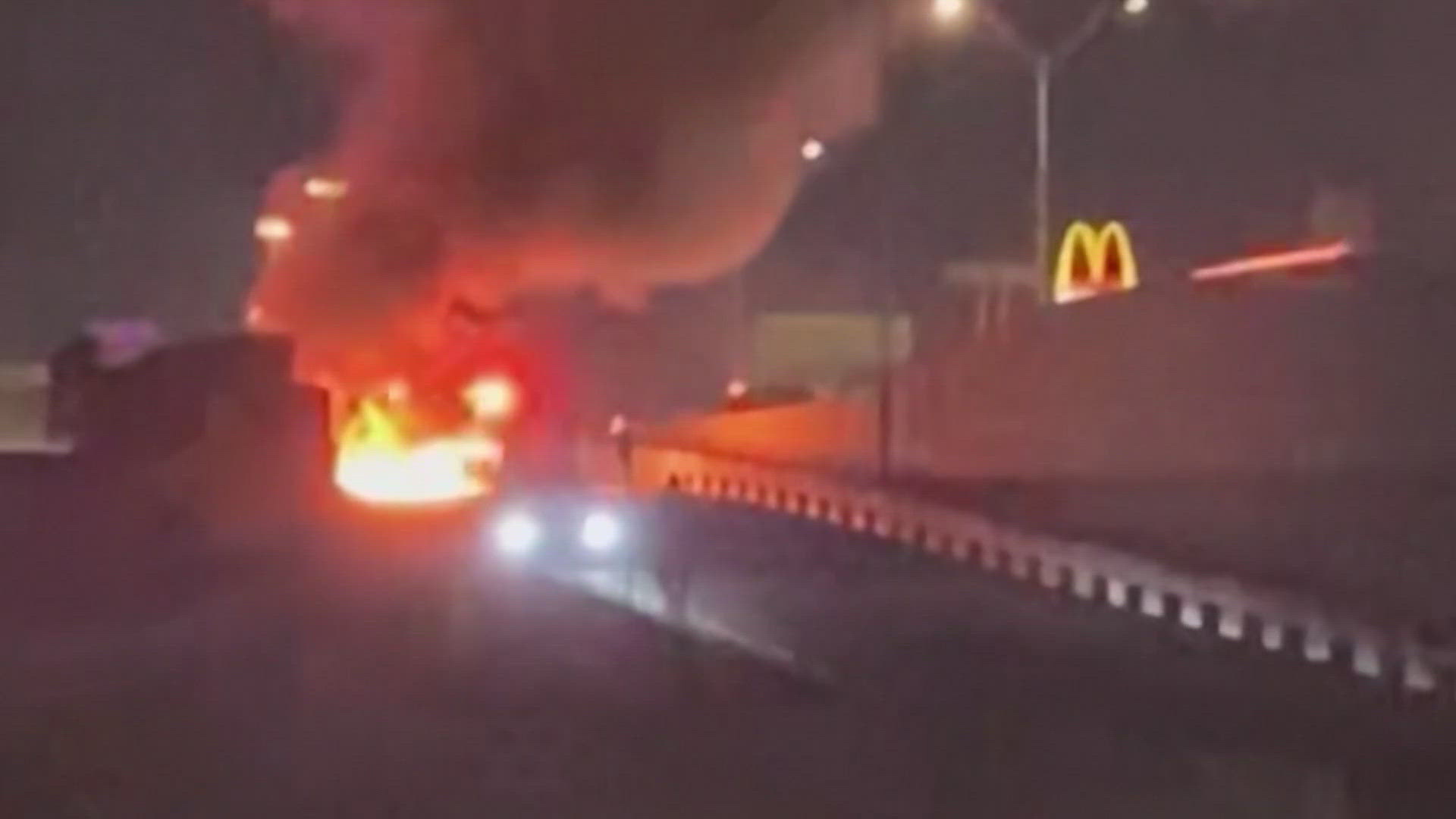 Cell phone video shows a Fort Worth family in a panic about an I-35W Freeway car on fire with another family trapped inside.