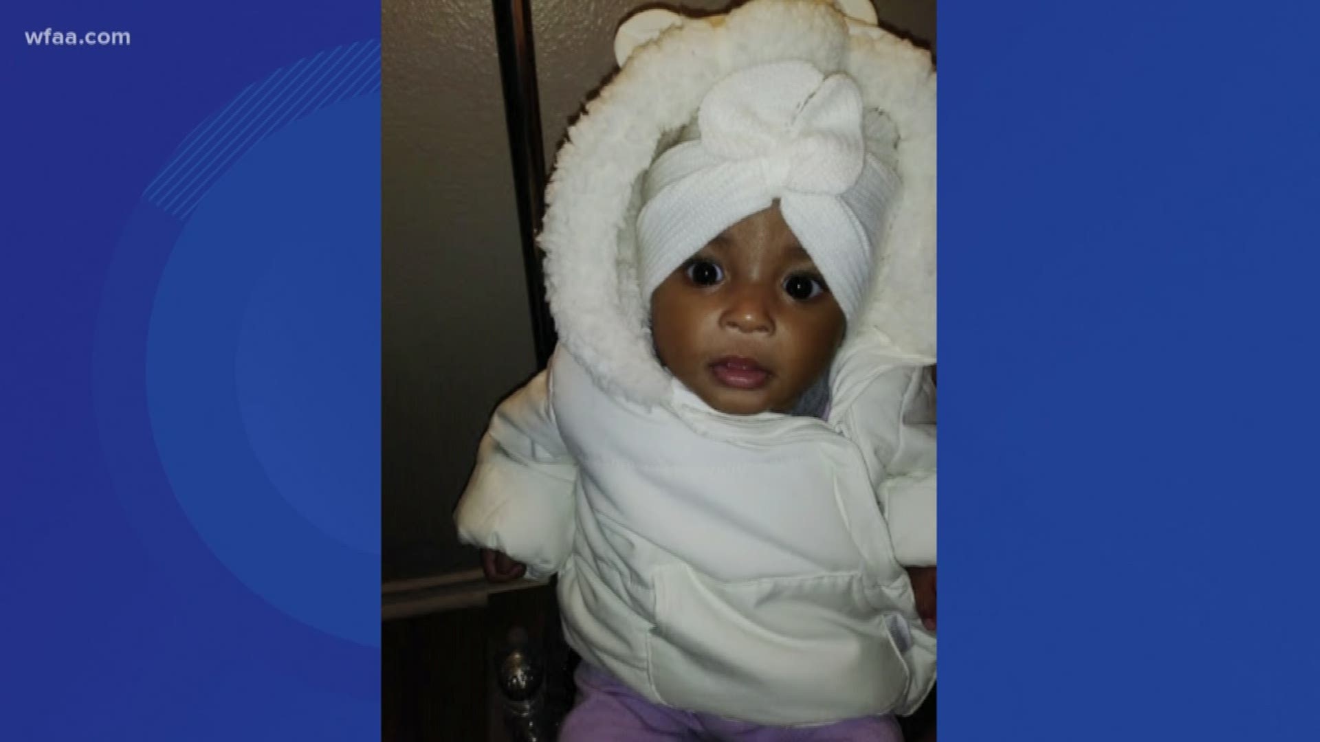 Eight-month-old Nyla Crockett is black and has brown hair and brown eyes.
