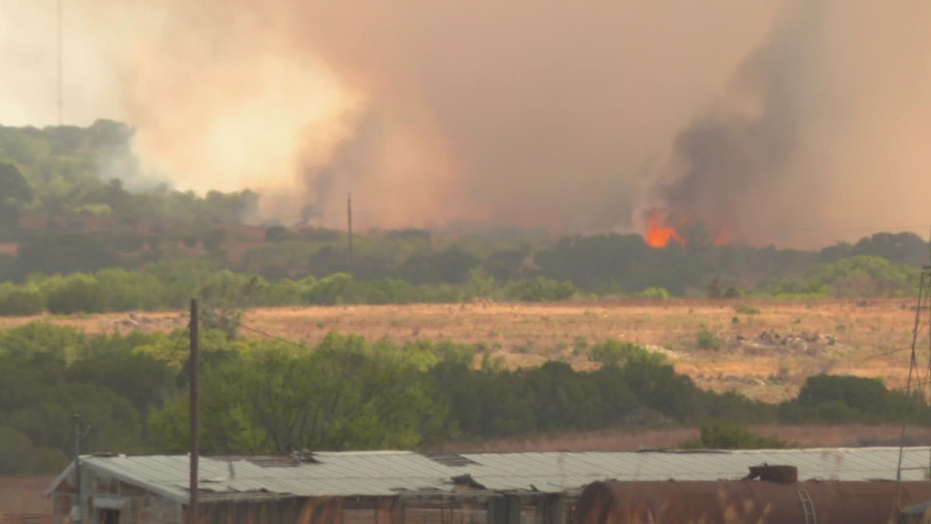 Officials say the fire, which has burned hundreds of acres, may have started from a group of workers who were welding.