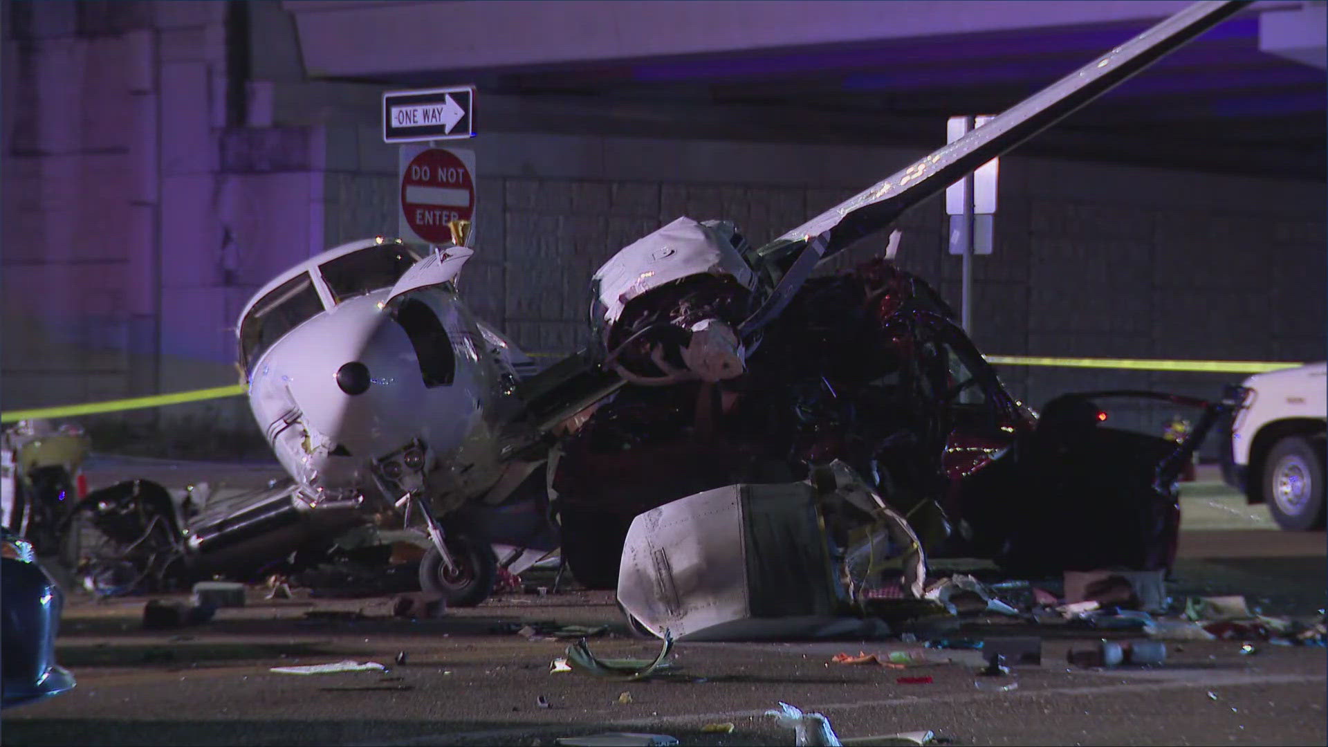 Images from the scene showed the plane split in half at the fuselage, and part of the plane wreckage sitting on top of a damaged car.