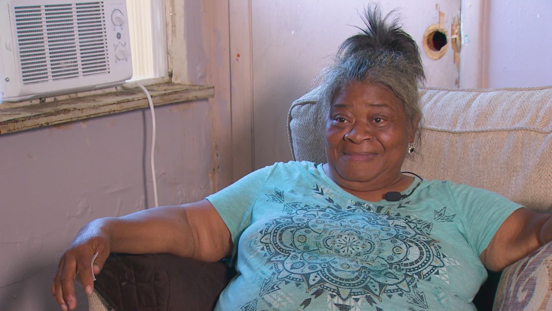 Lillie Littlejohn calls volunteers who installed her free window AC unit a godsend, saying temperatures feel like 120 degrees inside her home.