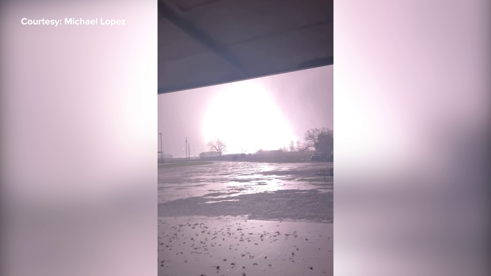 Video of a tornado passing through and damaging homes and property about three to five miles south of downtown Decatur, Texas, on FM 730