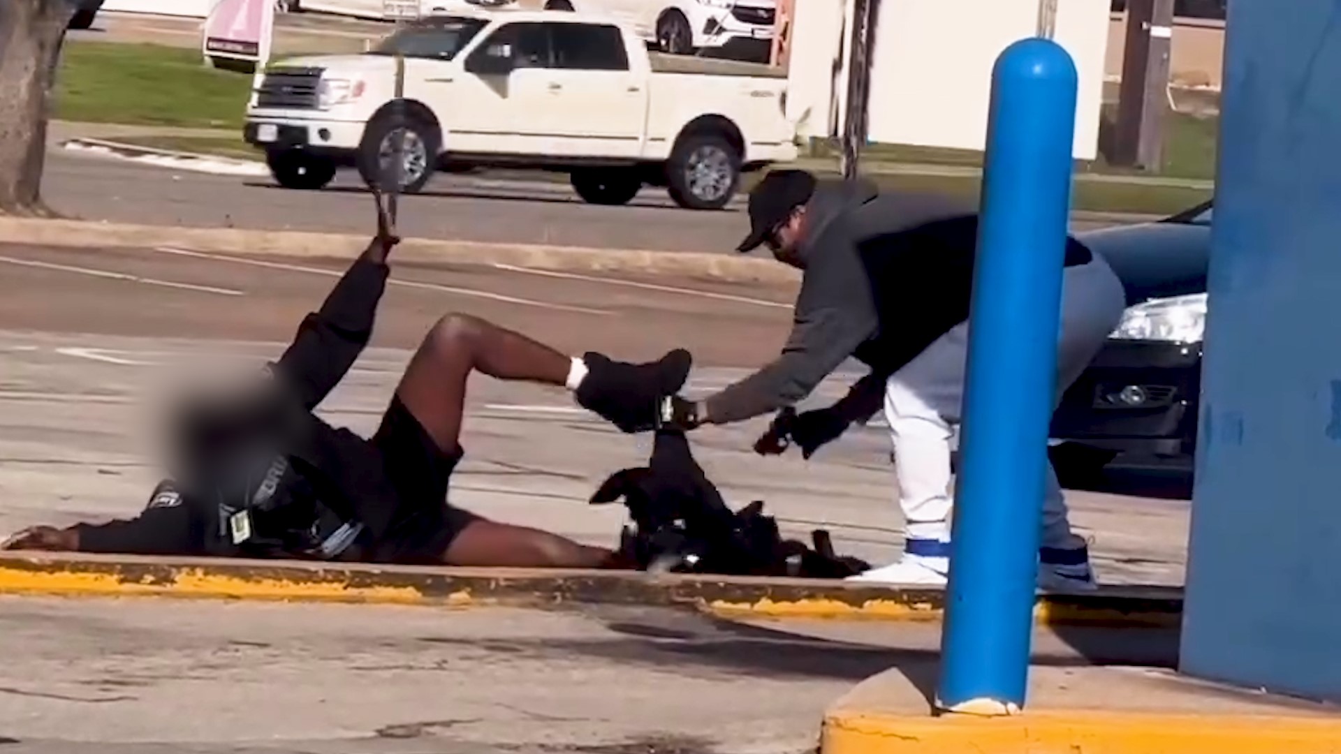 The suspect held a security guard at gunpoint, police say. The suspect unclothed him from the waist down to reportedly "ensure the guard could not retaliate."