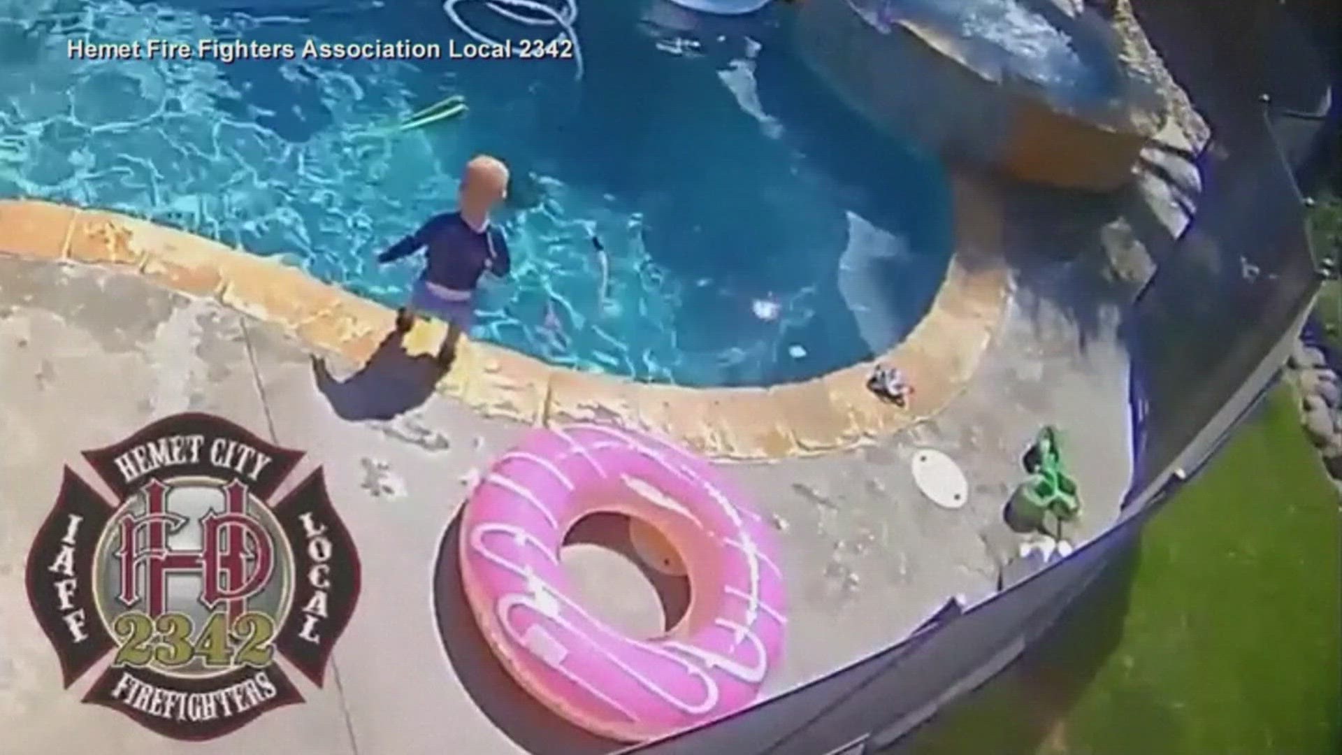 Security camera footage shows a firefighter saving his 1-year-old after he got in the pool when his dad wasn't watching.