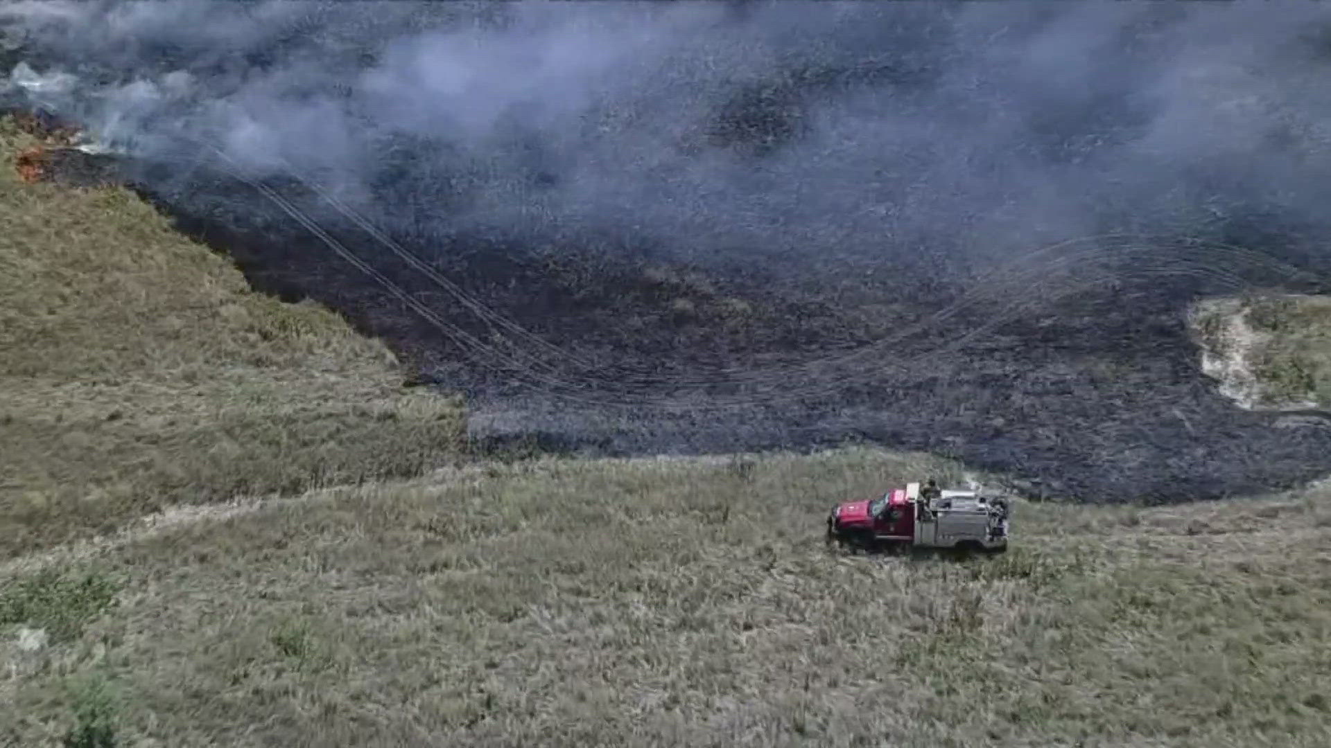 Chopper footage showed large areas of burnt grass in an unincorporated part of Parker County.