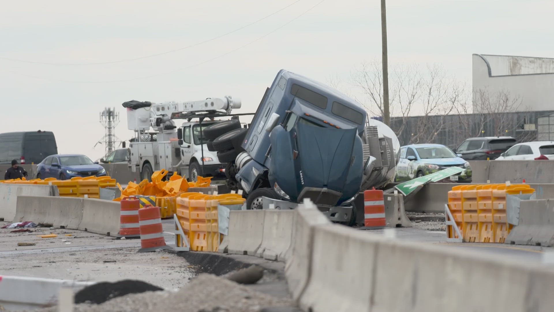 An 18-wheeler crashed into a concrete wall along I-635 in Garland on Thursday morning, blocking lanes of traffic and prompting a hazmat response.