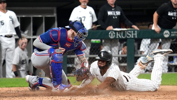 The Texas Rangers' Elvis Andrus shows off his beard to teammates durin a  workout for Game 6 of the American League Championship Series against the  Detroit Tigers at Rangers Ballpark in Arlington