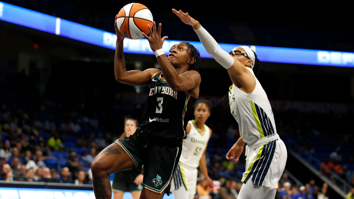 Dallas Wings guard Veronica Burton (12) dribbles during the first half of a  WNBA basketball basketball game against the Phoenix Mercury in Arlington,  Texas, Friday, June 9, 2023. (AP Photo/LM Otero Stock