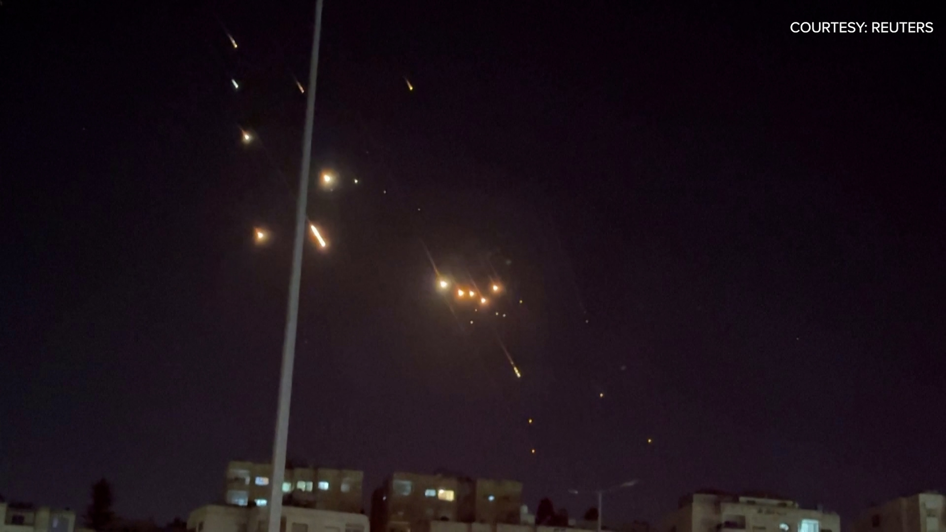 Iran says it fired dozens of missiles into Israel. This footage shows missiles flying over Jordan into Israel.