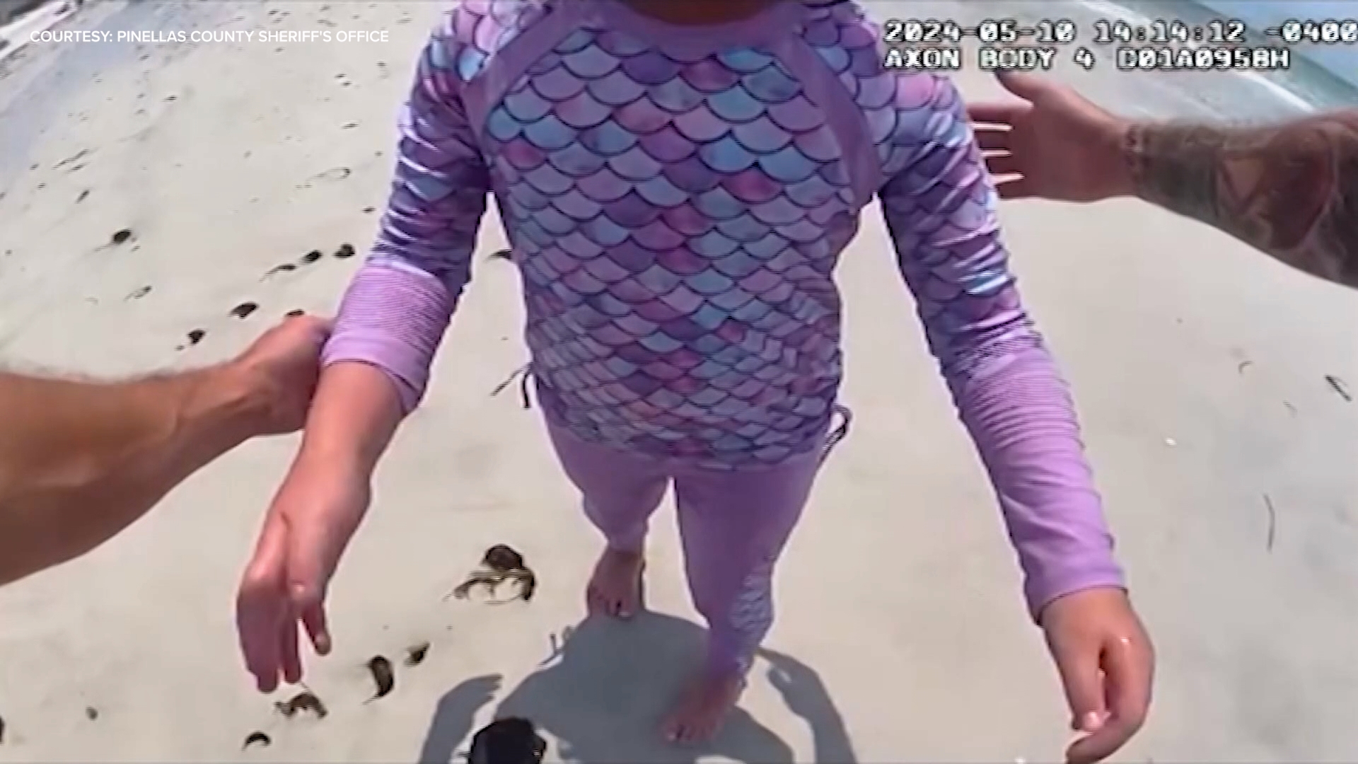 Bodycam video captured the moment a Florida deputy found a lost little girl wandering a beach and looking for her parents.