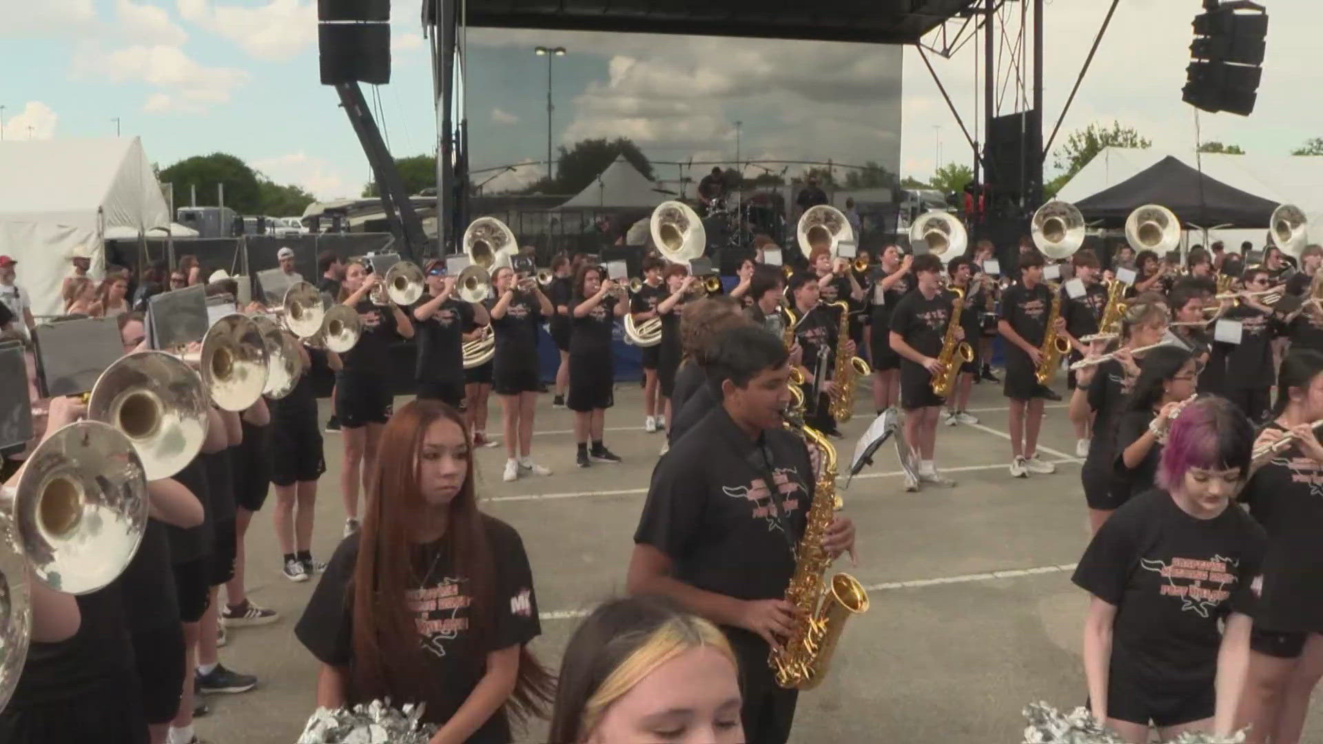 The Grapevine High School band performed outside AT&T Stadium before Post Malone's concert, celebrating their famous alumnus.