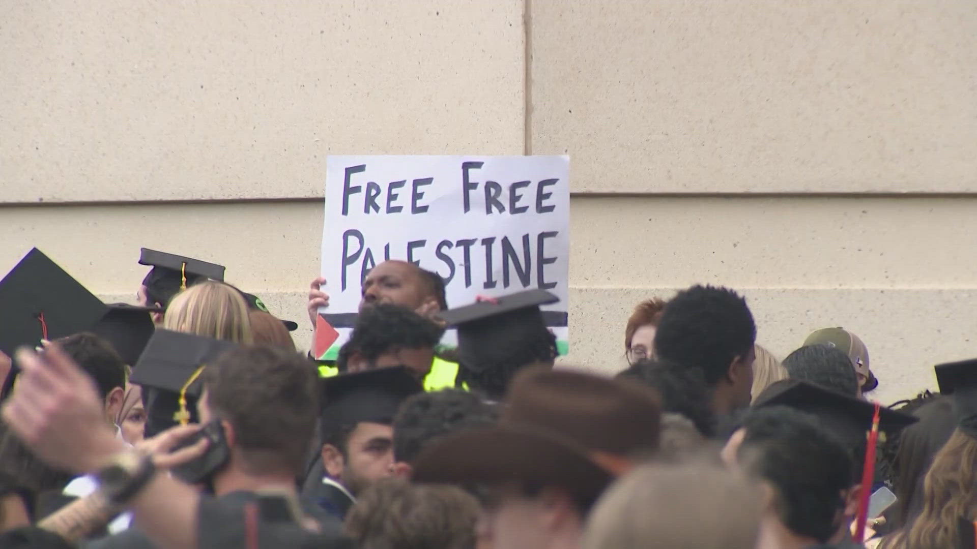Students showed their opposition to the war in Gaza through decorated caps and posters.
