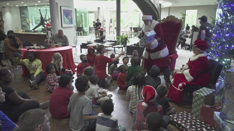 Santa and Mrs. Claus surprise kids at 15th annual CPS Christmas party at Dallas World Aquarium