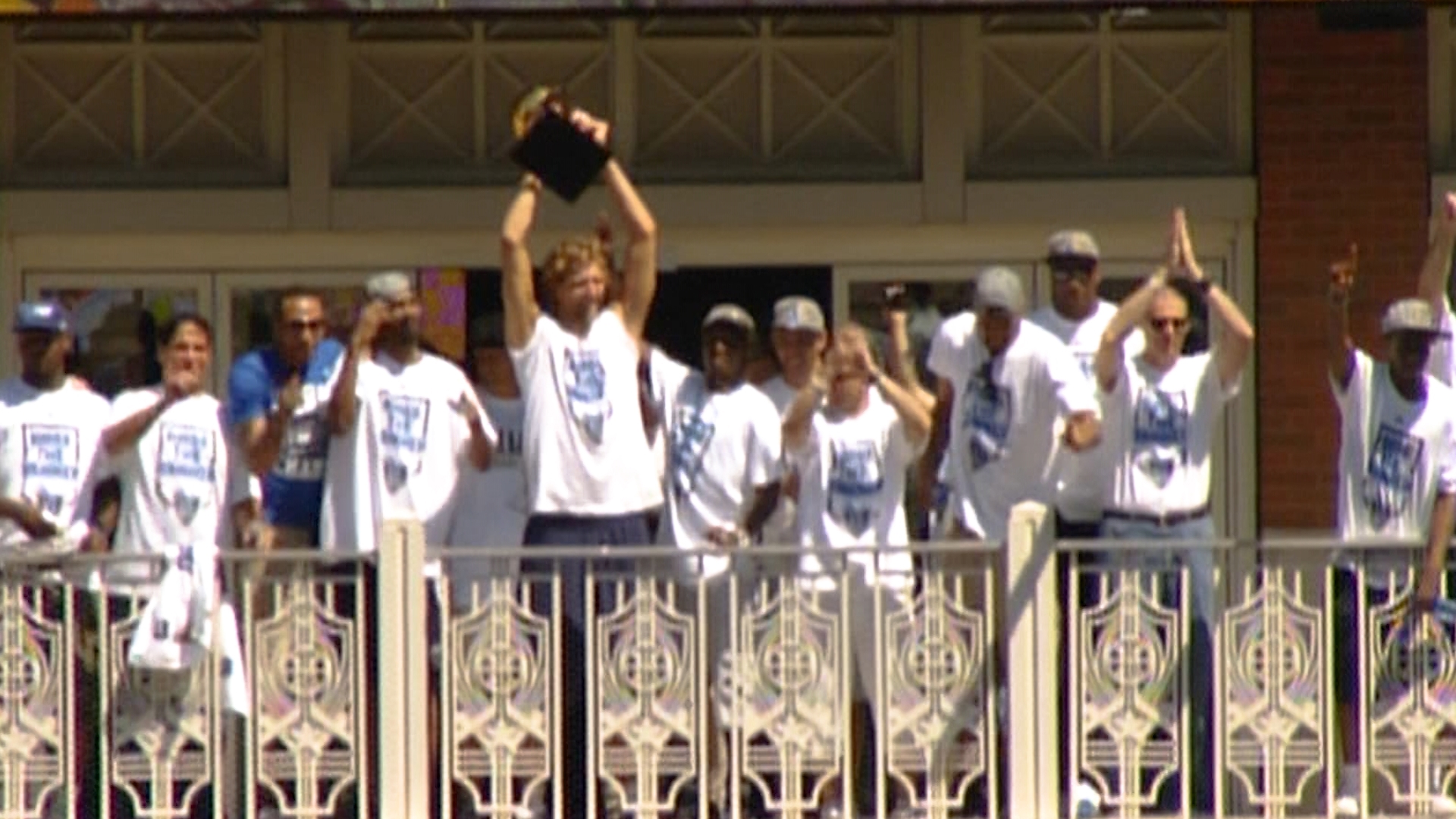 Dirk Nowitzki sings 'We Are the Champions' during the Dallas Mavericks' 2011 NBA Championship Parade on June 16, 2011, in Dallas, Texas.